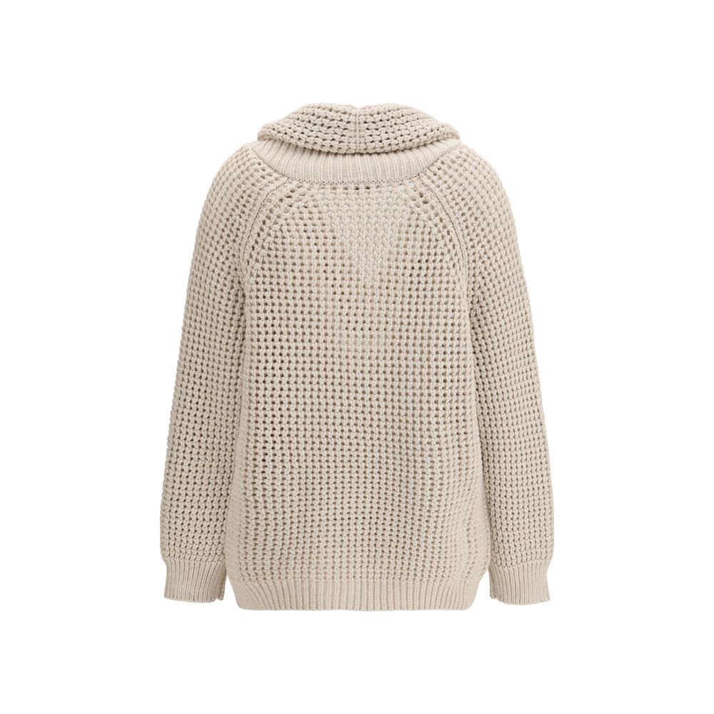 Experience the allure of the Brunello Cucinelli Beige Cotton Cardigan, a masterpiece of artisanal luxury crafted from a refined cotton blend, perfect for elegant layering.