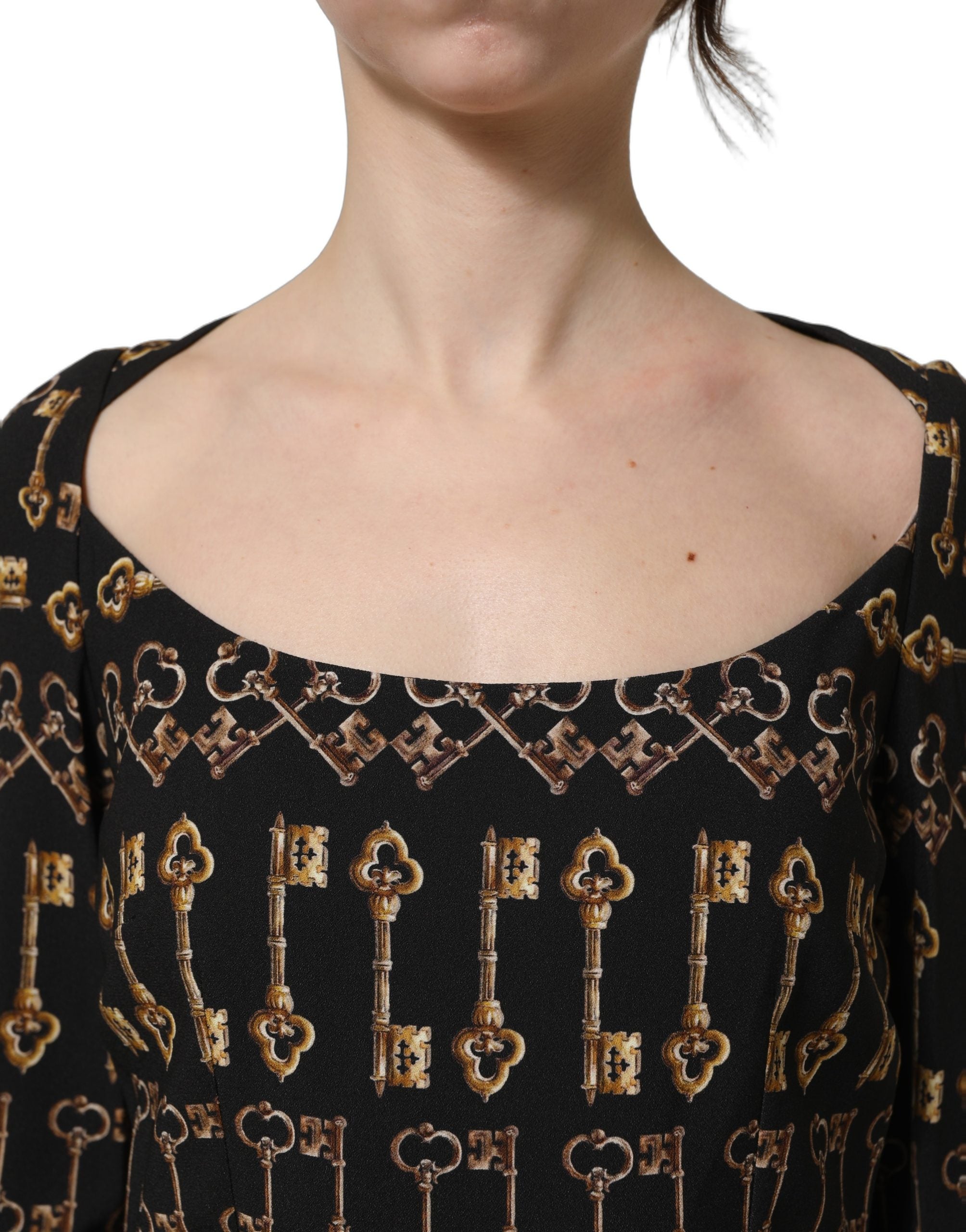Discover the Dolce & Gabbana Black Key Print Long Sleeves Sheath Midi Dress, a luxurious blend of 100% viscose and silk, epitomizing timeless elegance and exquisite craftsmanship.