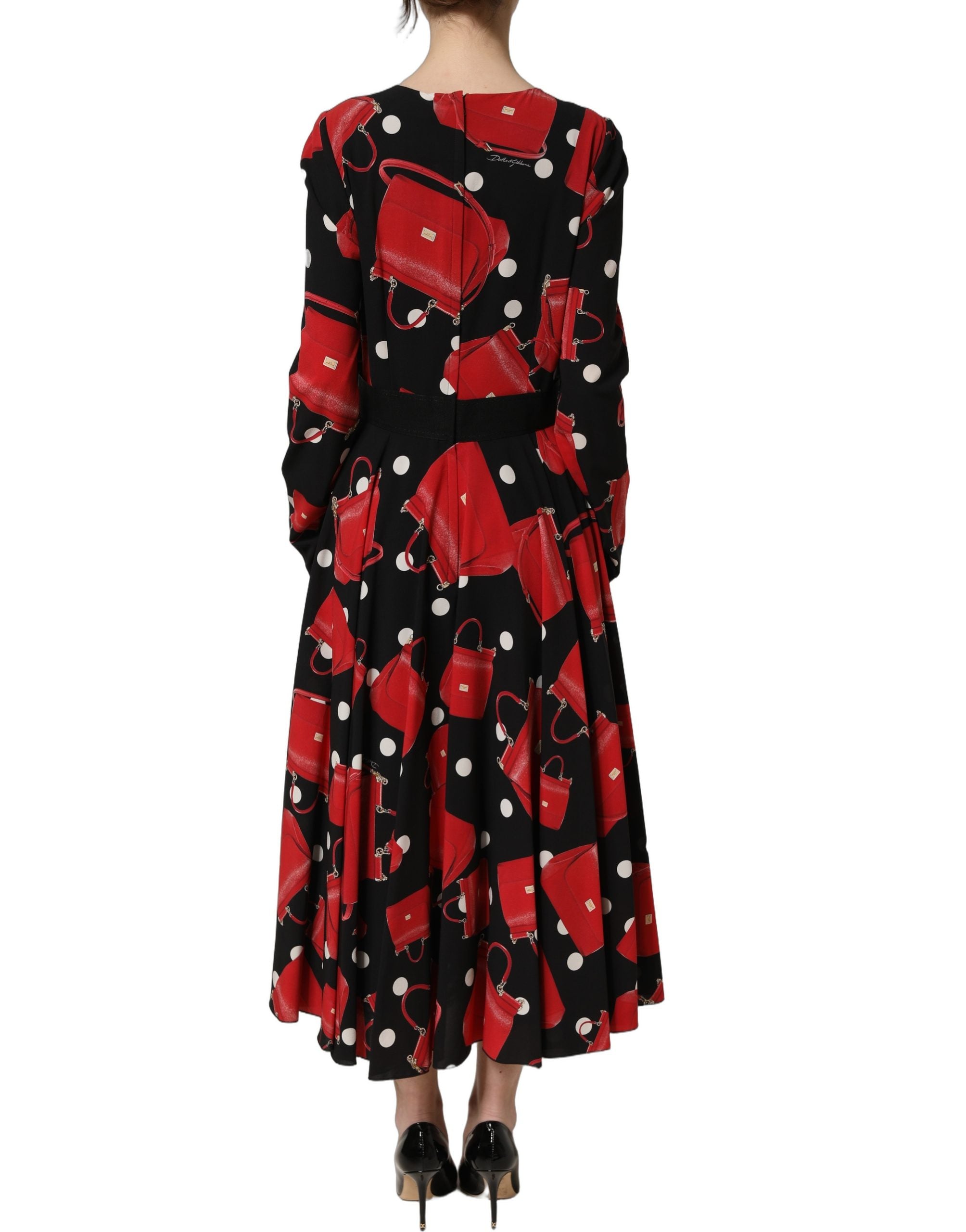 Elevate your wardrobe with the Dolce & Gabbana Black Handbag Print Long Sleeve Midi Dress, a masterpiece of silk and elastane that embodies luxury and sophistication.