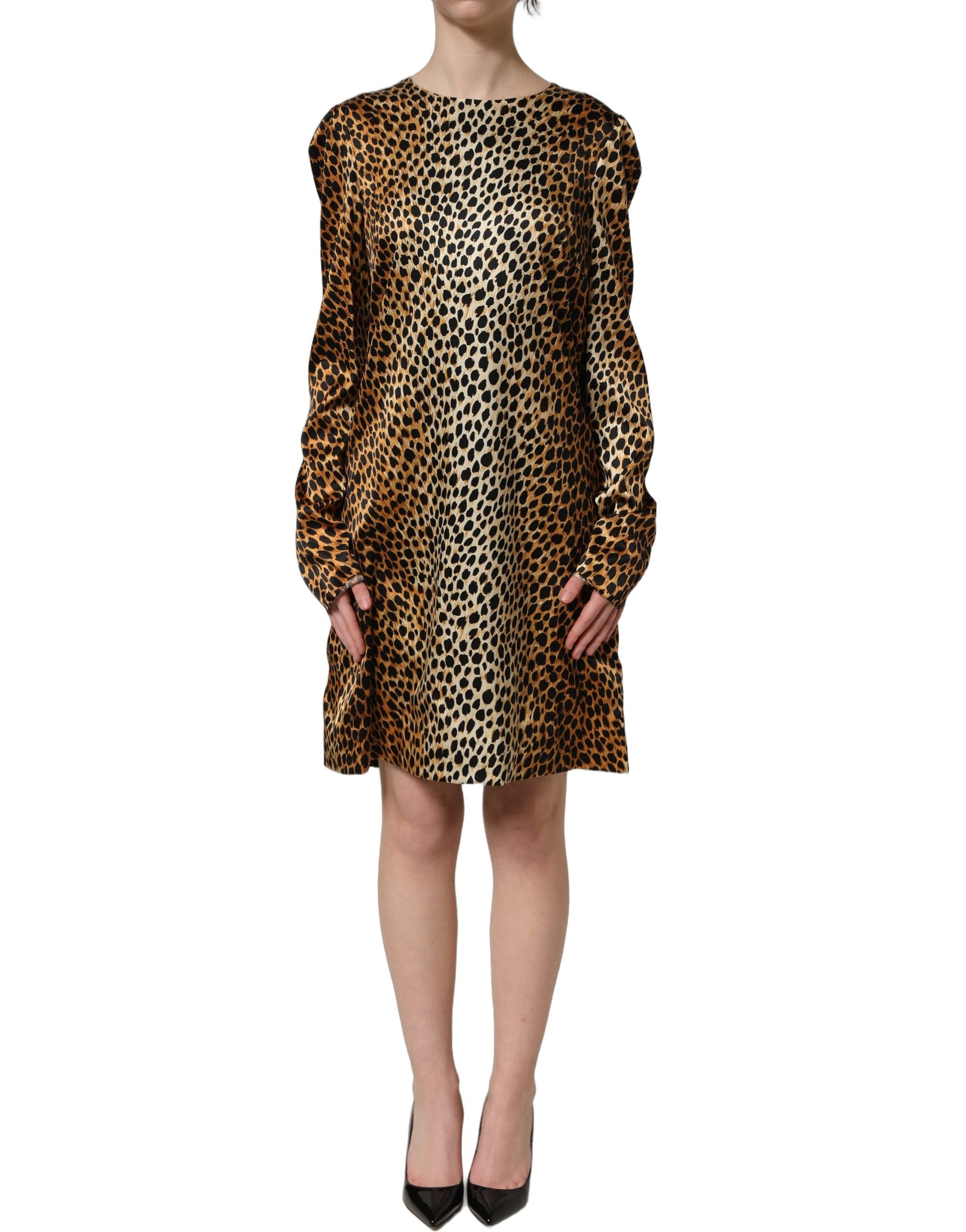 Experience the allure of the Dolce & Gabbana Brown Ocelot Print Long Sleeve Mini Dress, a silk masterpiece that embodies luxury and timeless elegance for the discerning individual.