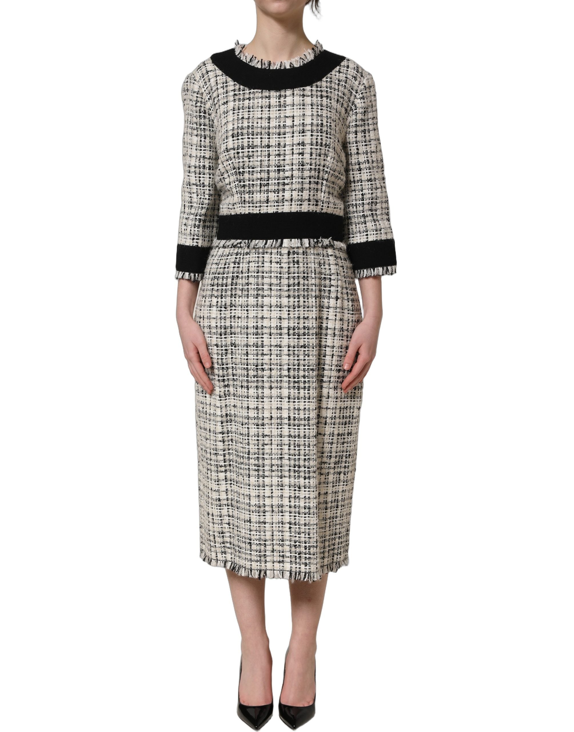 Elevate your elegance with the Dolce & Gabbana Multicolor Bouclé Tweed Midi Dress, a masterpiece of Italian craftsmanship, blending luxurious textures for timeless allure.