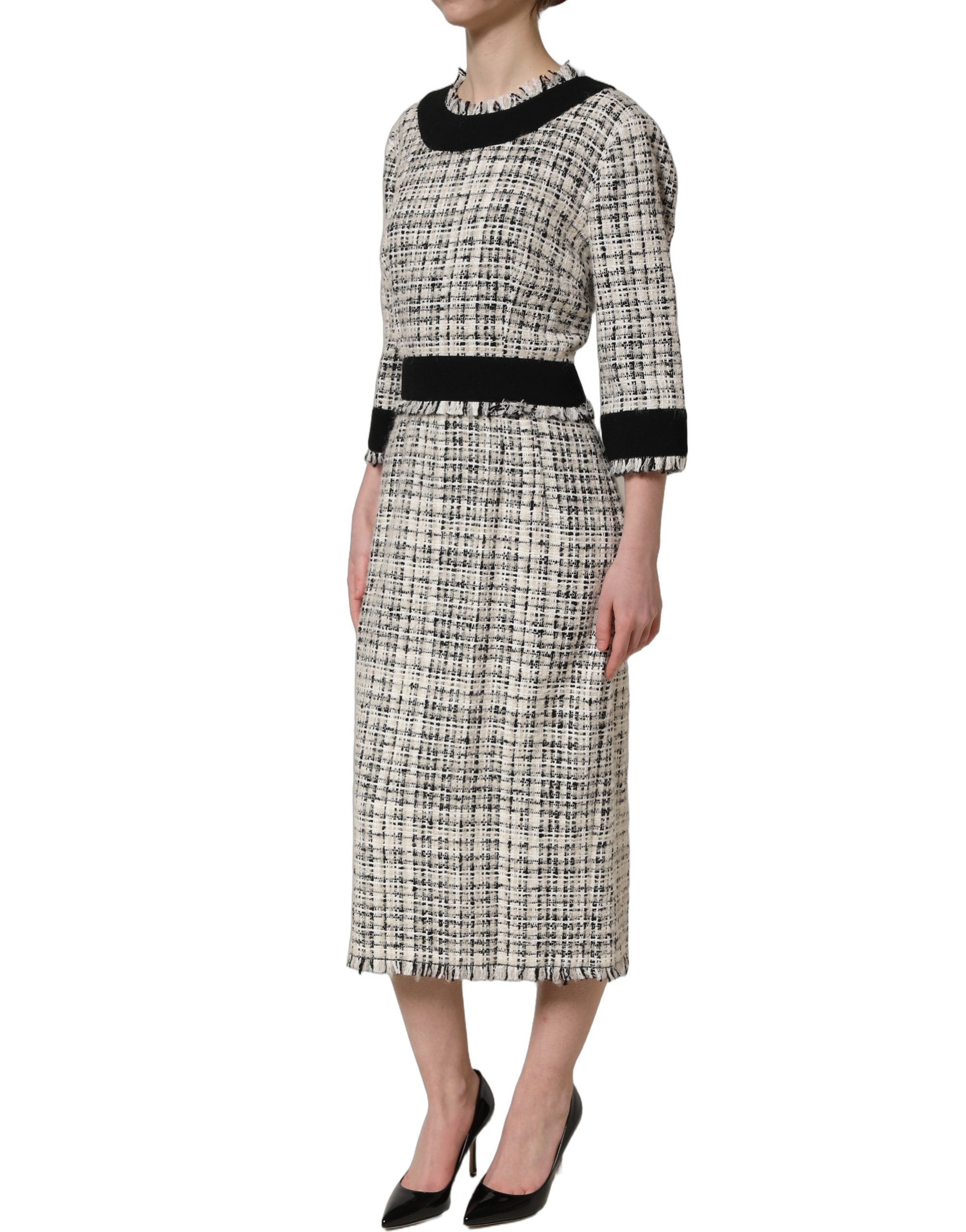 Elevate your elegance with the Dolce & Gabbana Multicolor Bouclé Tweed Midi Dress, a luxurious blend of artisanal craftsmanship and timeless allure, perfect for sophisticated occasions.