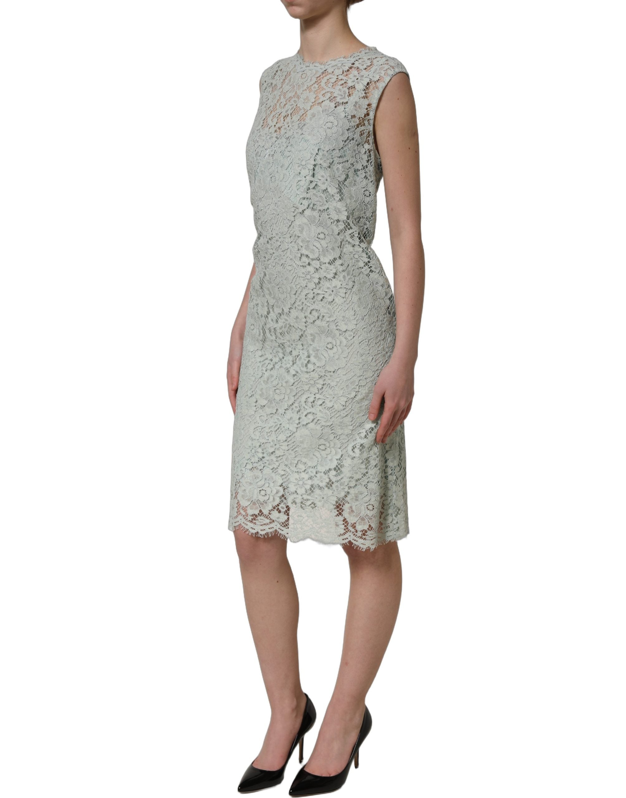 Experience the allure of the Dolce & Gabbana Mint Green Lace Sleeveless Dress, a masterpiece of exquisite craftsmanship and luxurious materials, perfect for unforgettable moments.
