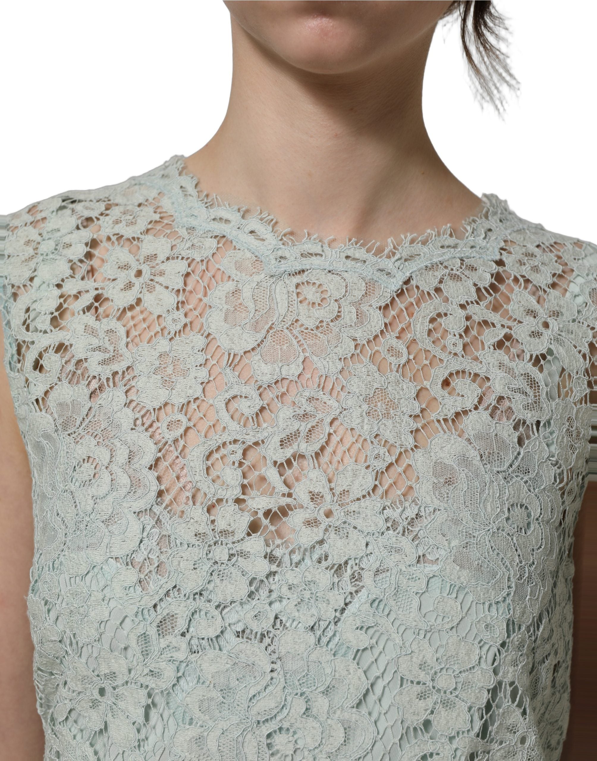 Discover the exquisite Dolce & Gabbana Mint Green Lace Sleeveless Dress, a timeless masterpiece of floral lace and silk, embodying luxury and elegance for every occasion.