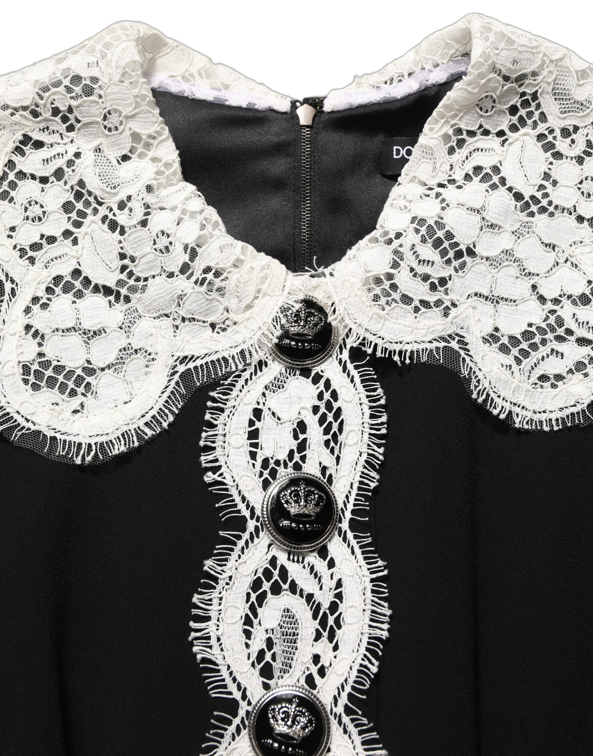 Indulge in the exquisite allure of the Dolce & Gabbana Black Lace Detailing Long Sleeves Midi Dress, a masterpiece of Italian craftsmanship that embodies timeless elegance and sophistication.
