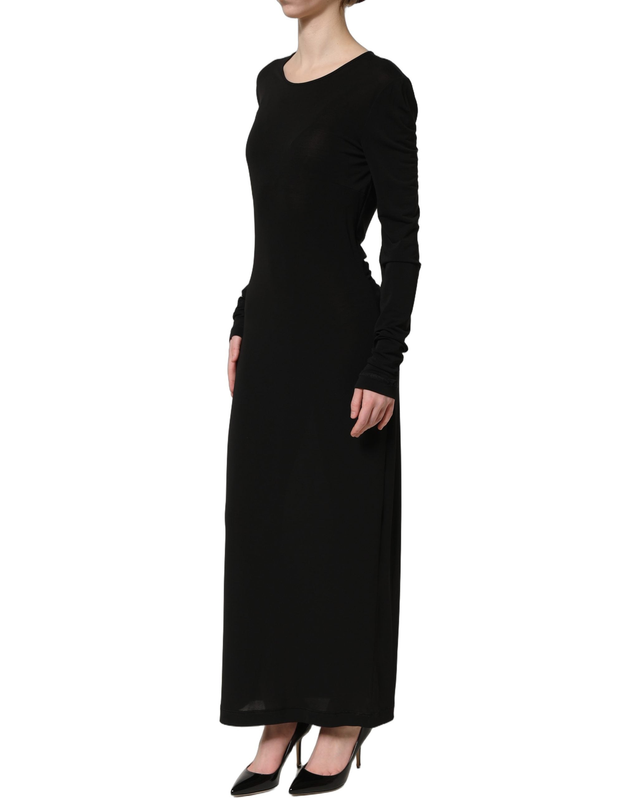 Experience the allure of Dolce & Gabbana's Black Cotton Long Sleeves Sheath Maxi Dress, a masterpiece of Italian craftsmanship that redefines elegance for every occasion.