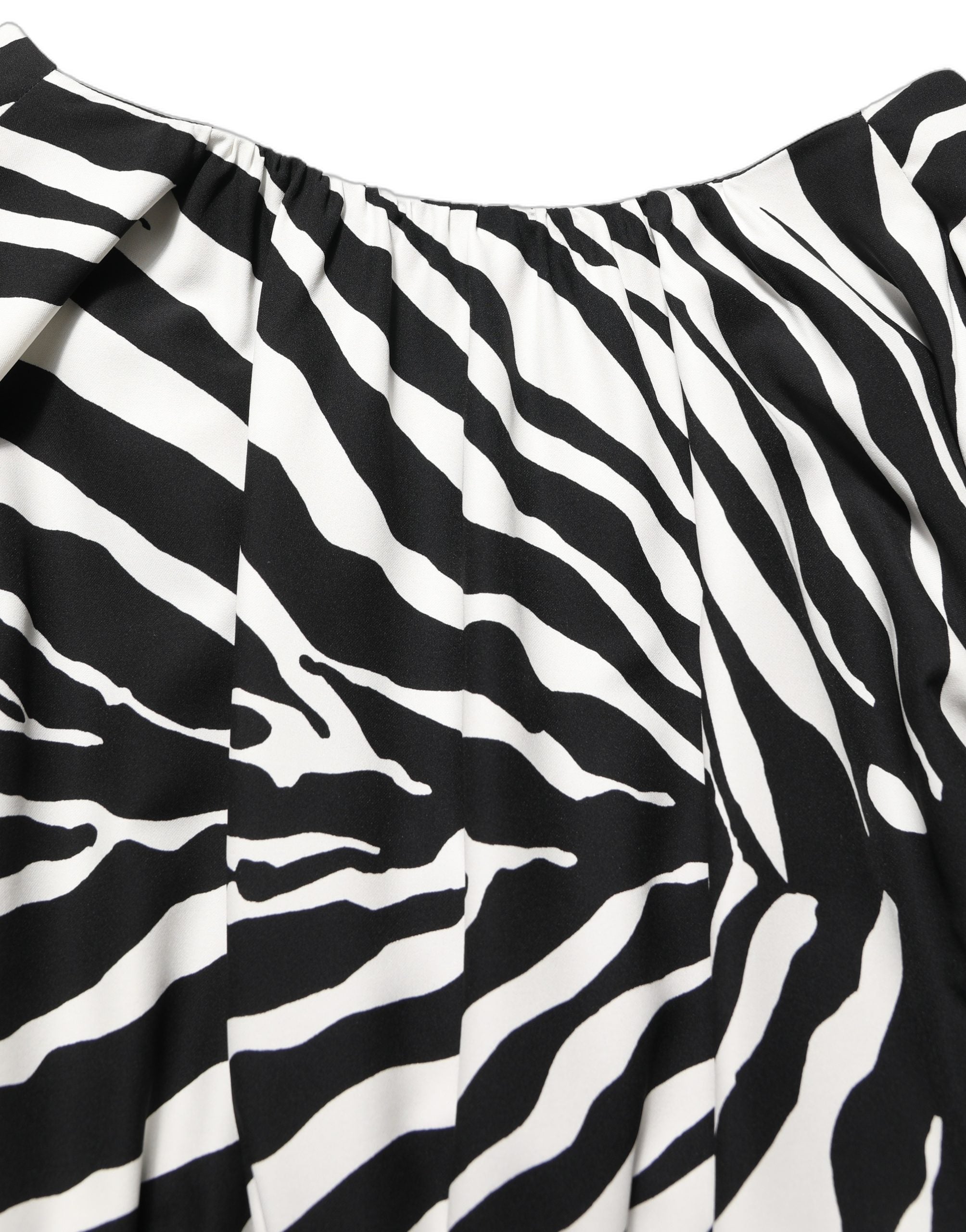 Elevate your wardrobe with the Dolce & Gabbana Black White Zebra Ruched Silk Mini Dress, a masterpiece of Italian craftsmanship that exudes luxury and sophistication.