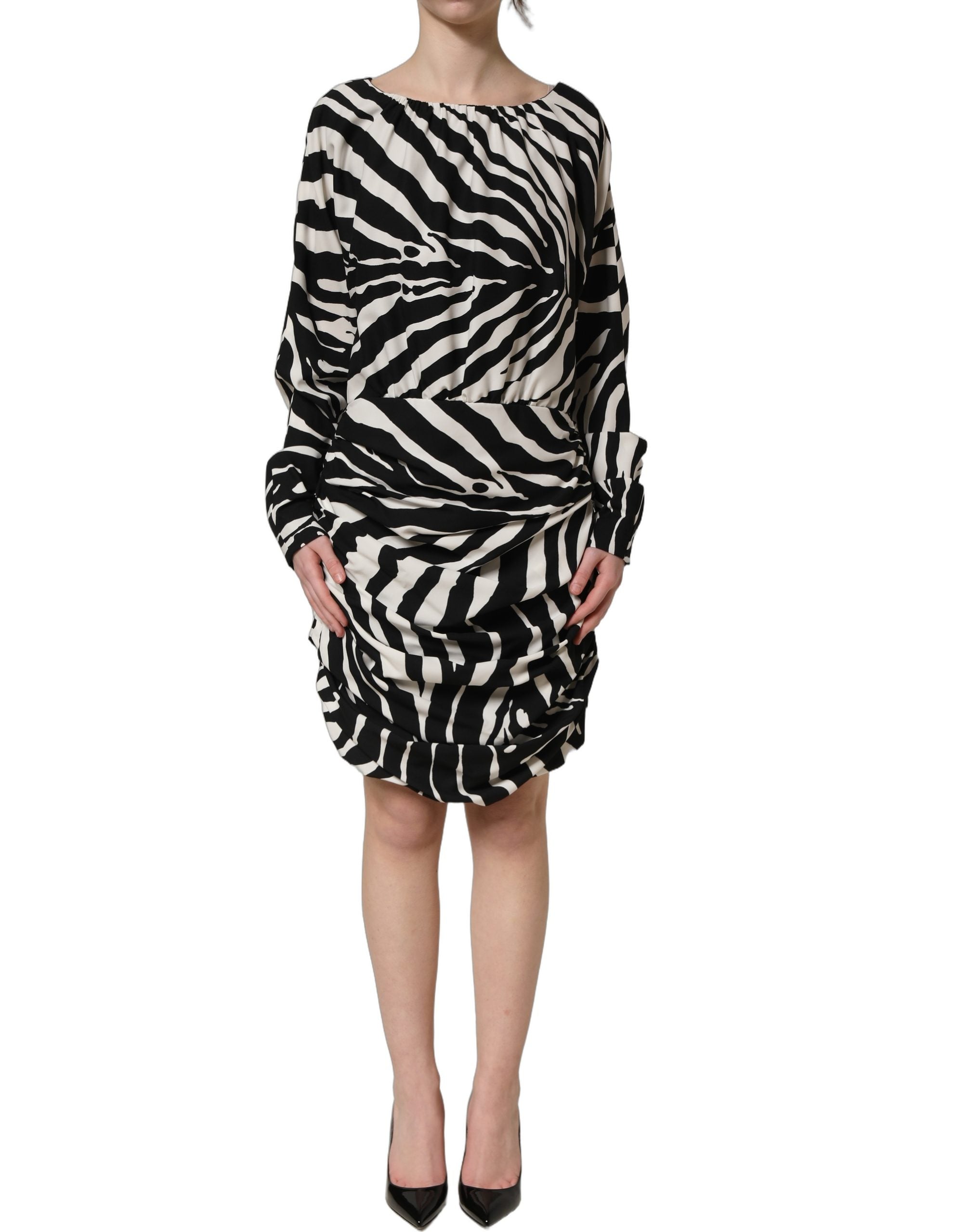 Elevate your wardrobe with the Dolce & Gabbana Black White Zebra Ruched Silk Mini Dress, a luxurious blend of silk and elastane, embodying exquisite Italian craftsmanship and timeless elegance.