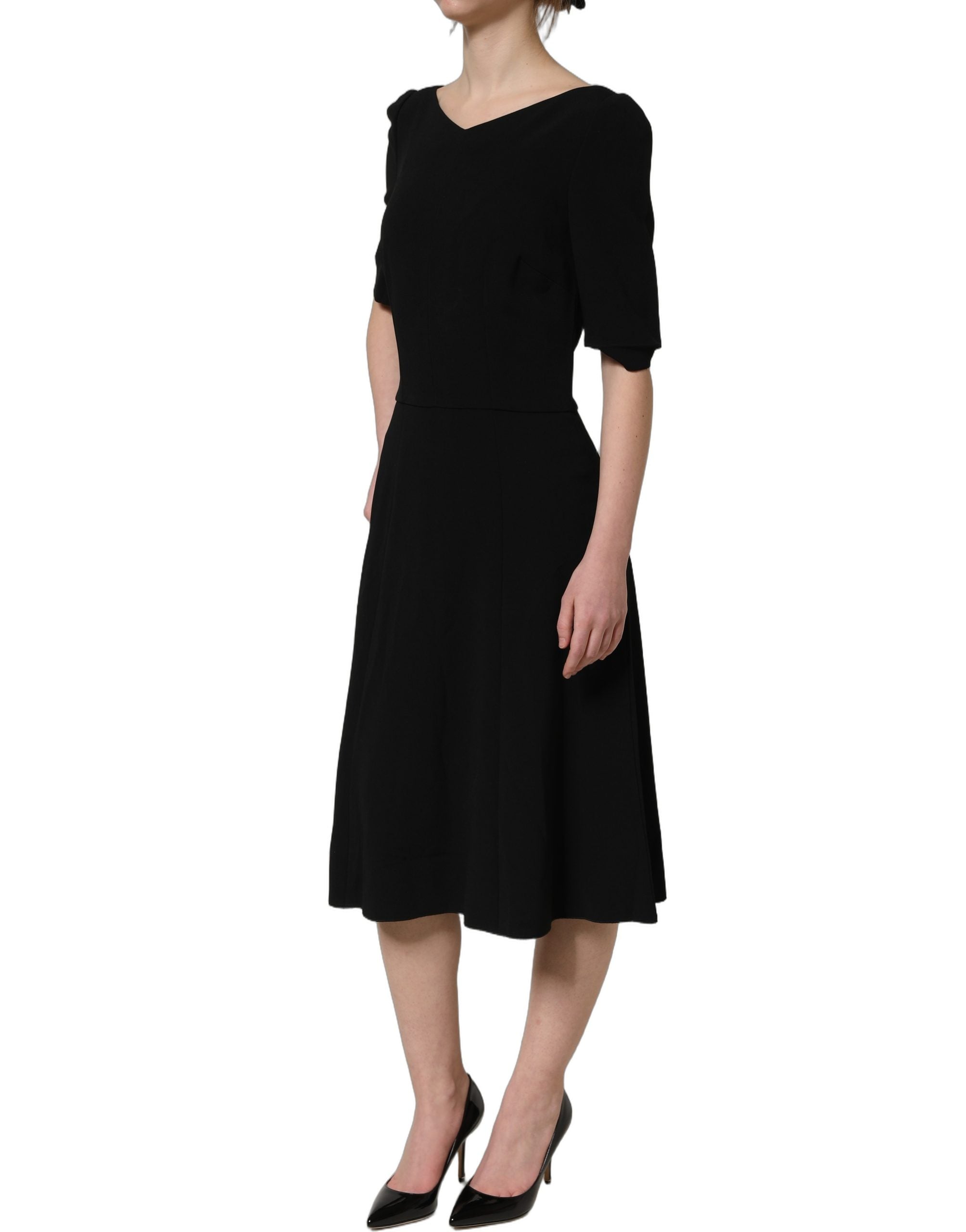 Elevate your elegance with the Dolce & Gabbana Black Viscose Short Sleeve A-line Midi Dress, a masterpiece of luxurious craftsmanship and timeless allure.