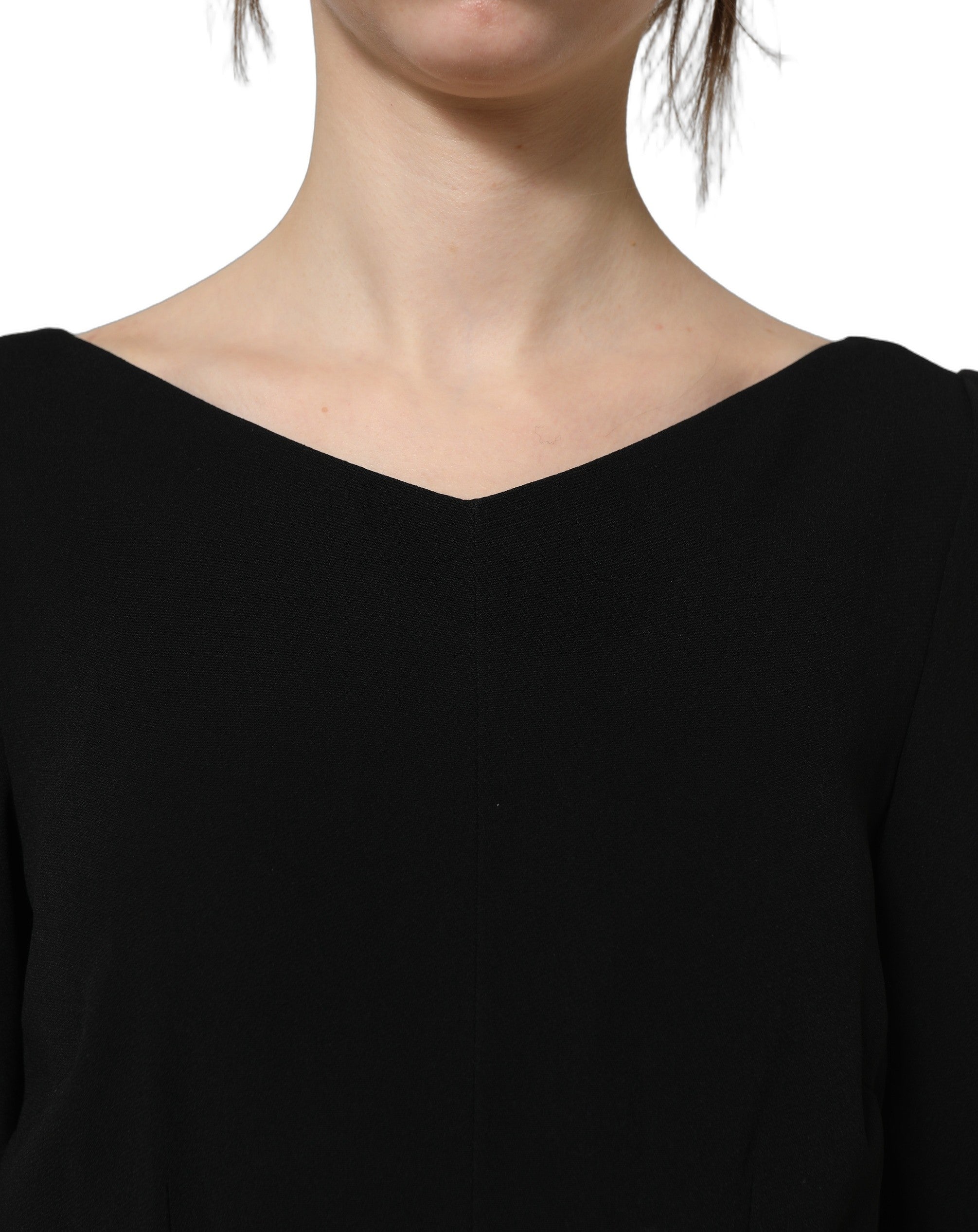 Experience the exquisite allure of Dolce & Gabbana's Black Viscose Short Sleeve A-line Midi Dress, a masterpiece of luxurious craftsmanship and timeless elegance.