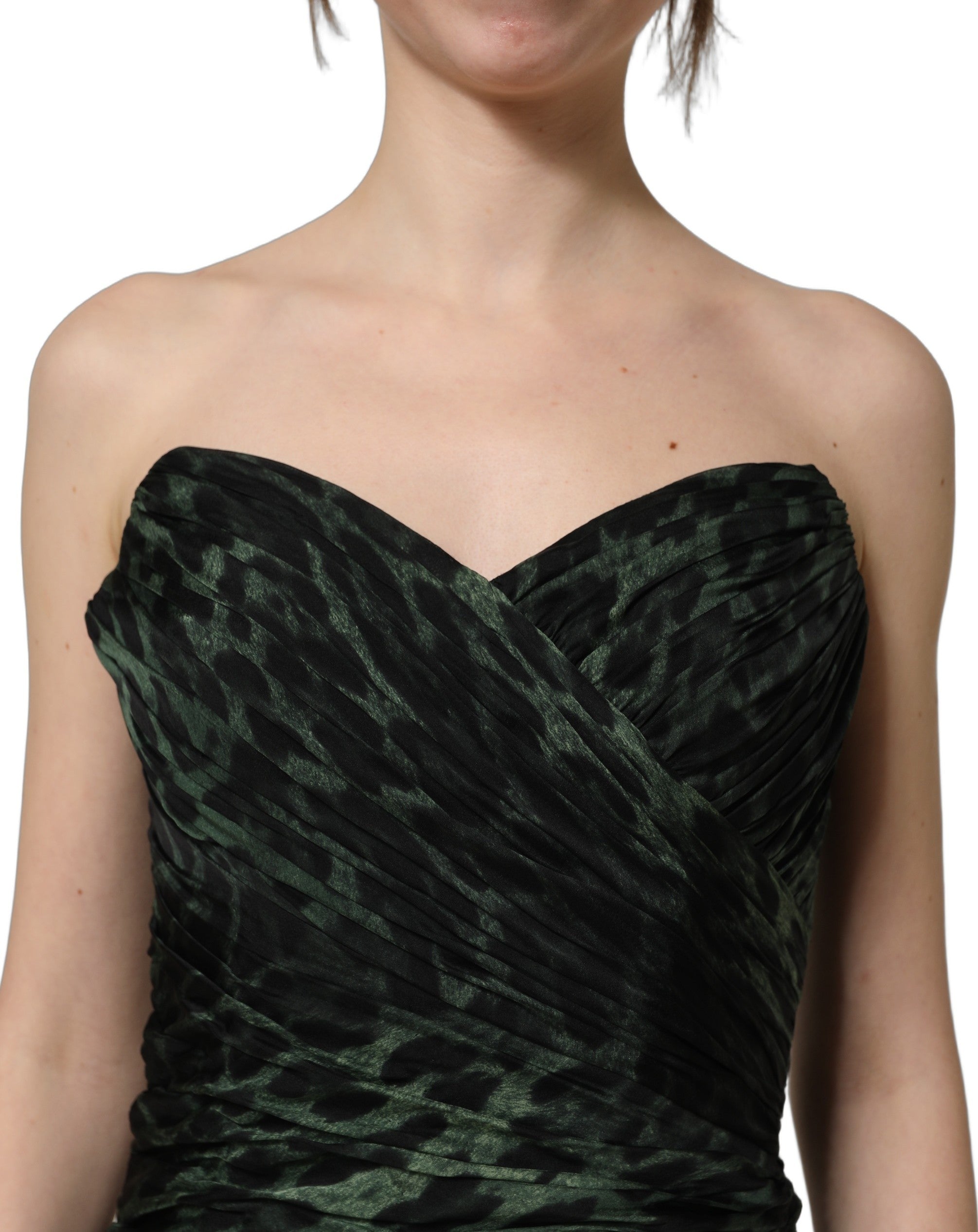 Discover the exquisite Dolce & Gabbana Green Leopard Print Bustier Draped Midi Dress, a silk masterpiece that embodies luxury and sophistication for the discerning individual.