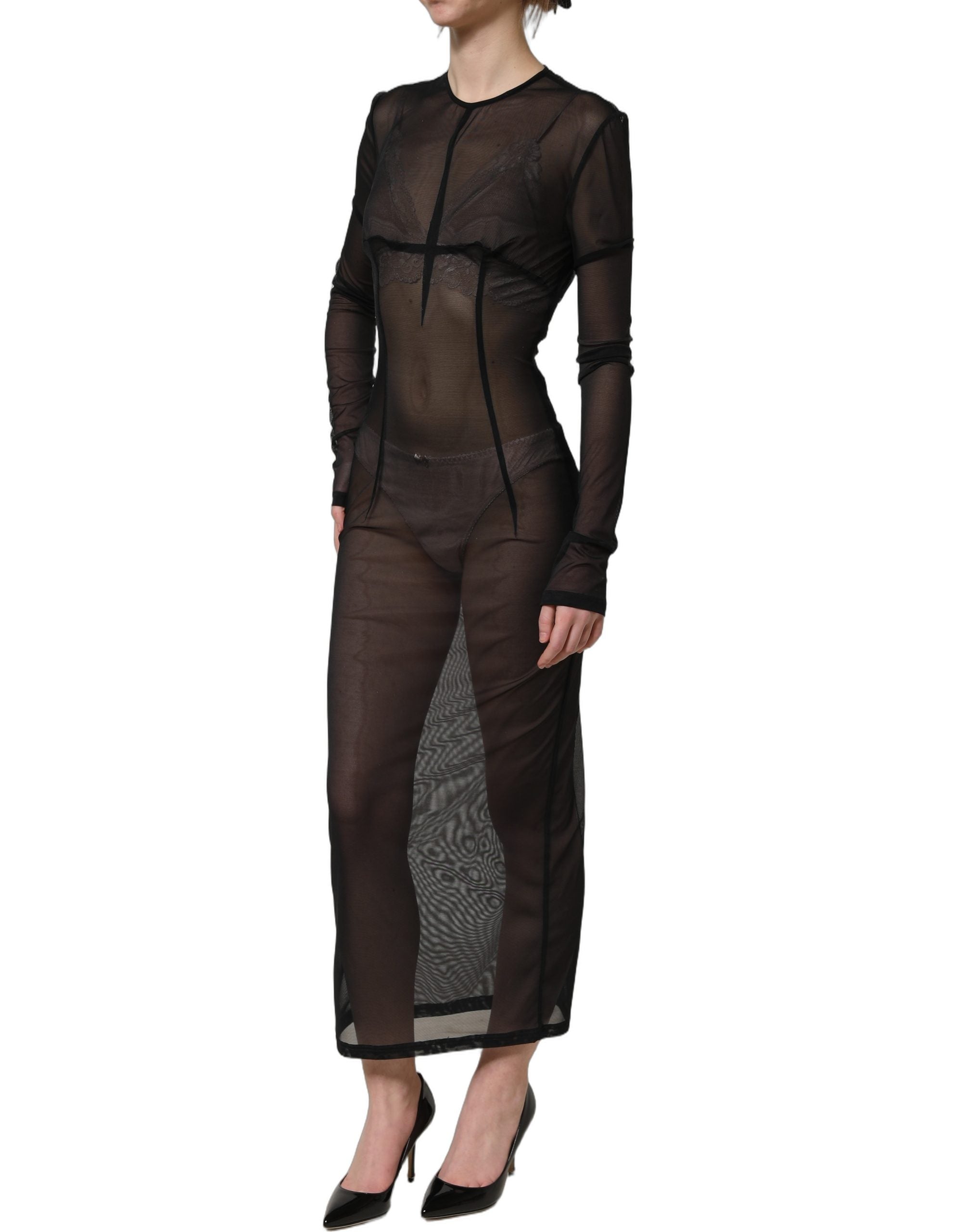 Indulge in the allure of the Dolce & Gabbana Black Long Sleeve Sheer Fitted Maxi Dress, where exquisite craftsmanship meets timeless elegance, perfect for unforgettable moments.
