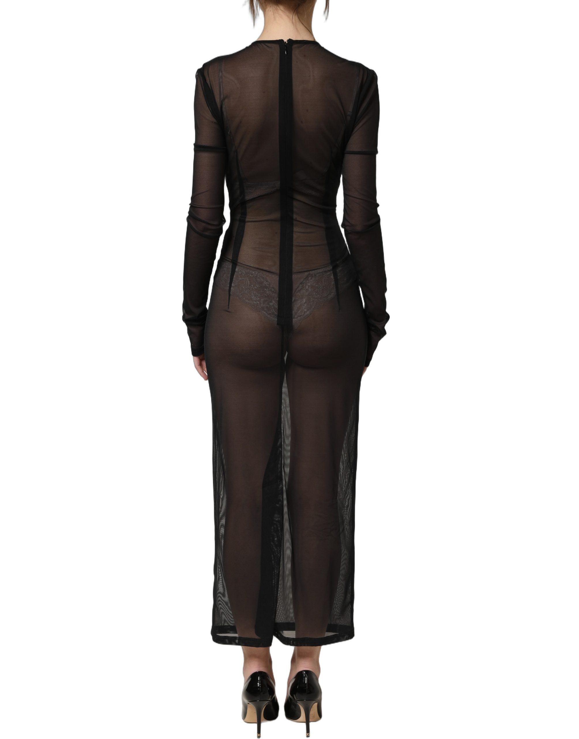Indulge in the exquisite allure of the Dolce & Gabbana Black Long Sleeve Sheer Fitted Maxi Dress, a masterpiece of Italian craftsmanship that redefines luxury and elegance.