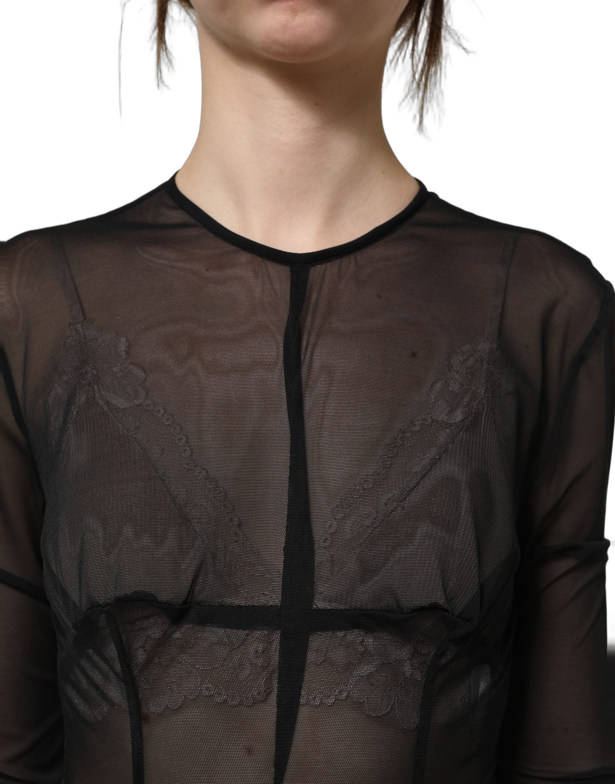 Experience the allure of the Dolce & Gabbana Black Long Sleeve Sheer Fitted Maxi Dress, a masterpiece of Italian craftsmanship that embodies timeless elegance and sophistication.