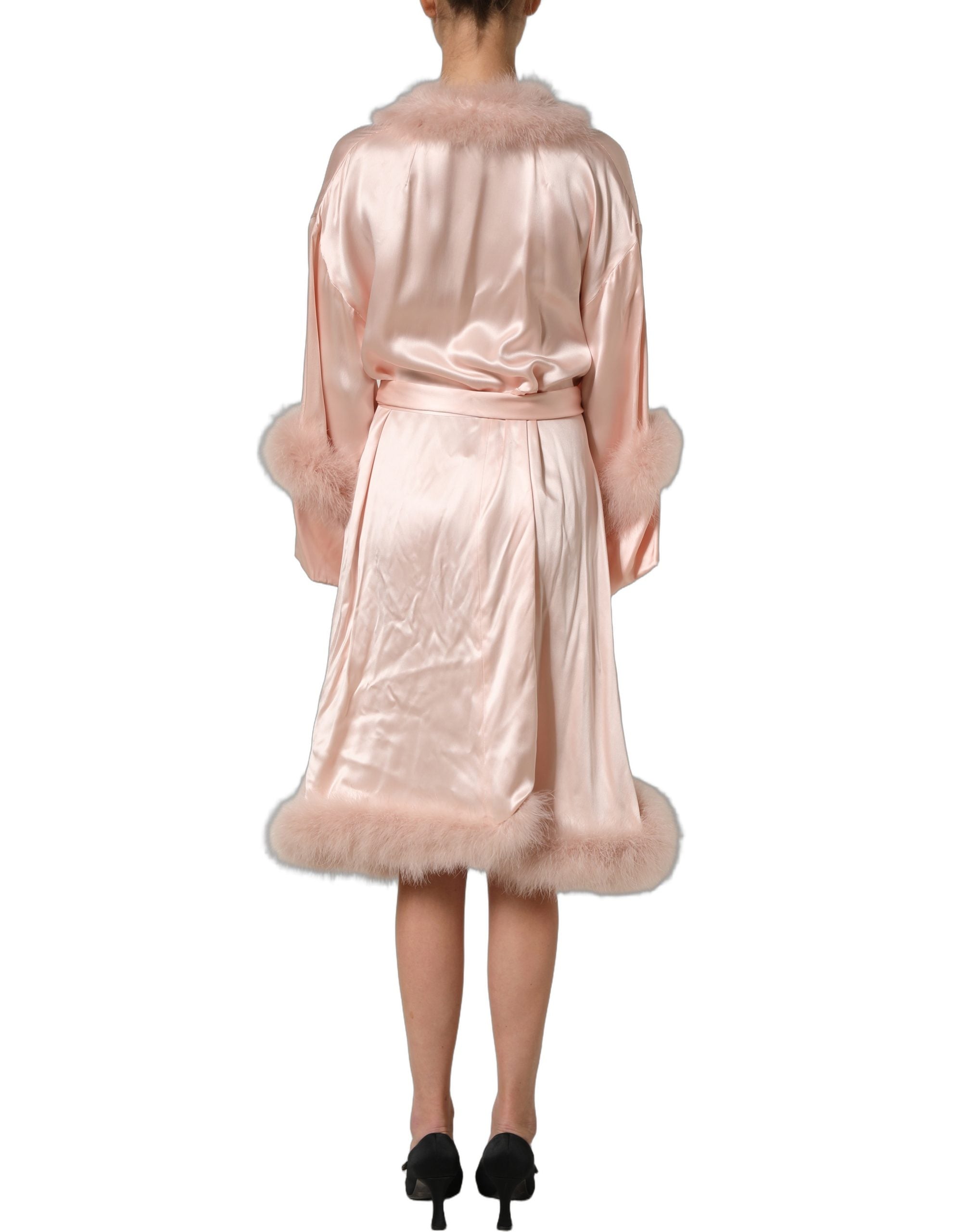 Experience the allure of the Dolce & Gabbana Light Pink Silk Turkey Feather Wrap Midi Dress, where exquisite craftsmanship meets luxurious silk for an unforgettable statement.