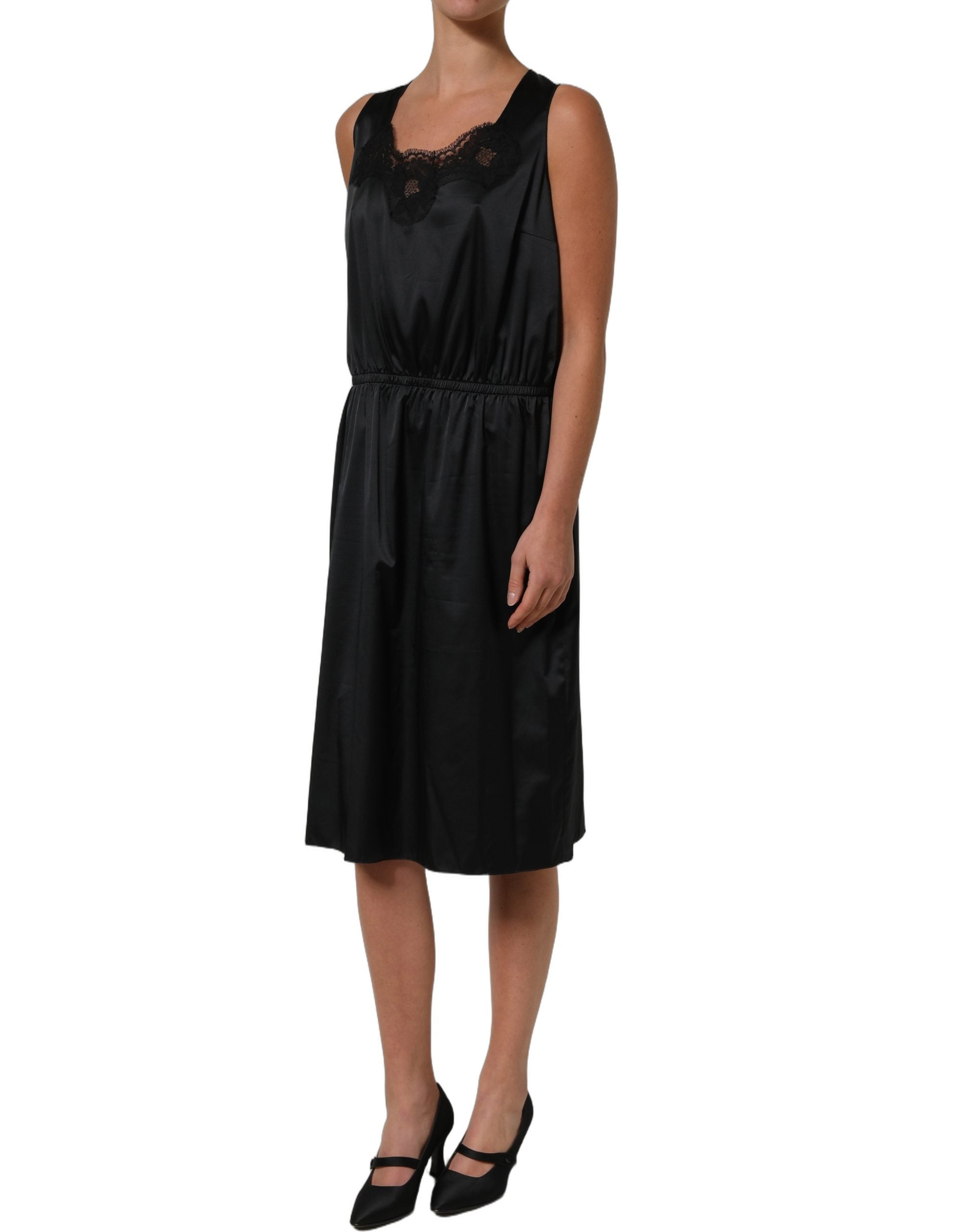 Experience the allure of the Dolce & Gabbana Black Lace Trim Midi Dress, a masterpiece of Italian craftsmanship that embodies timeless elegance and sophisticated luxury.