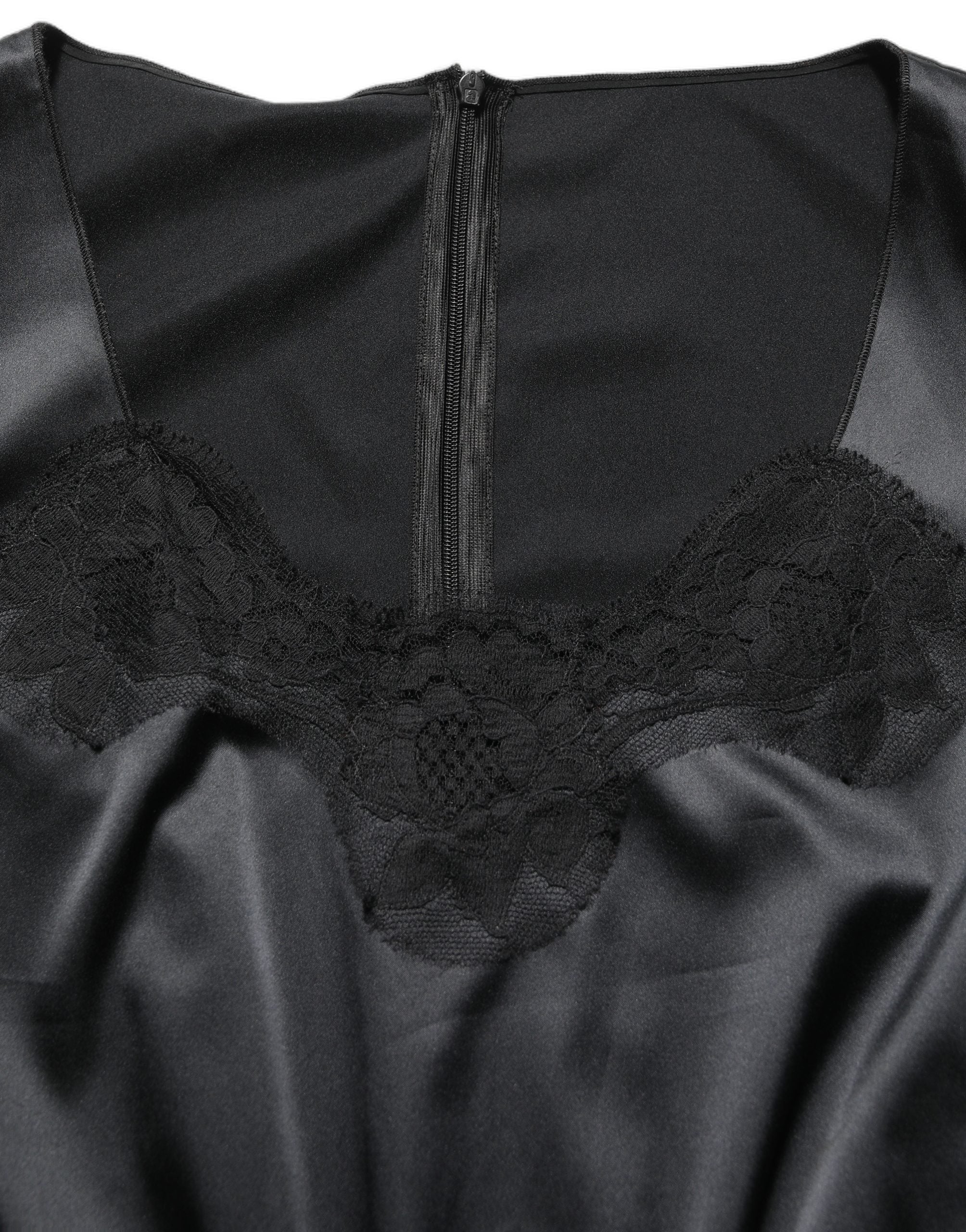 Discover the exquisite Dolce & Gabbana Black Lace Trim Midi Dress, a timeless piece of Italian craftsmanship that embodies luxury and sophistication for any discerning wardrobe.
