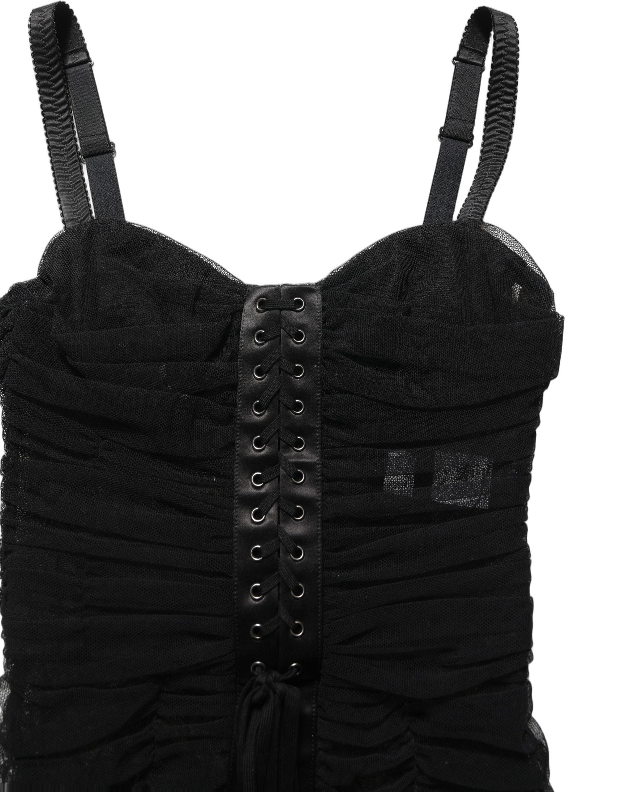 Indulge in the exquisite allure of Dolce & Gabbana's fitted black dress, a testament to Italian craftsmanship that embodies timeless elegance and sensual sophistication.
