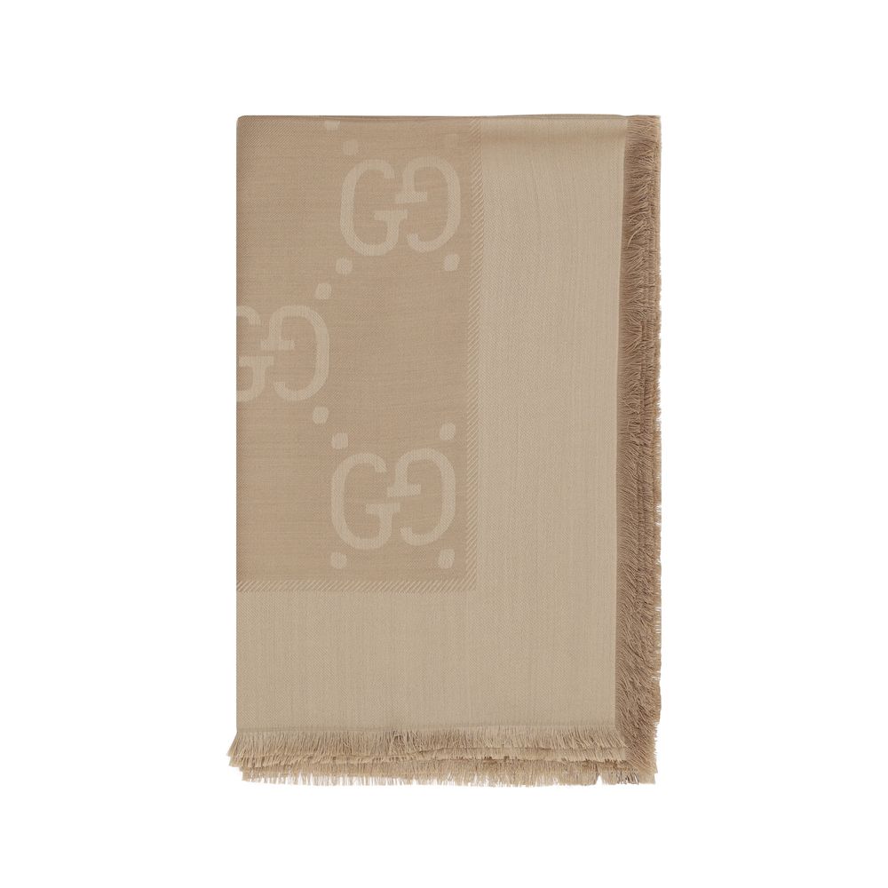 Indulge in the elegance of the Gucci Brown Wool Oves Aries Foulard, crafted from luxurious wool and silk, embodying sophistication and timeless style for every occasion.
