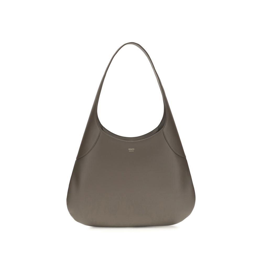 Elevate your style with the Khaite Gray Calf Leather Bos Taurus Handbag, a fusion of artisanal craftsmanship and modern elegance, perfect for the discerning individual.