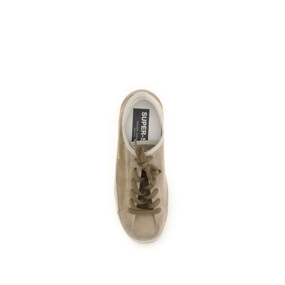 Indulge in the exquisite Golden Goose Beige Calf Leather Bos Taurus Low Top Sneakers, where artisanal craftsmanship meets timeless elegance for the discerning connoisseur.