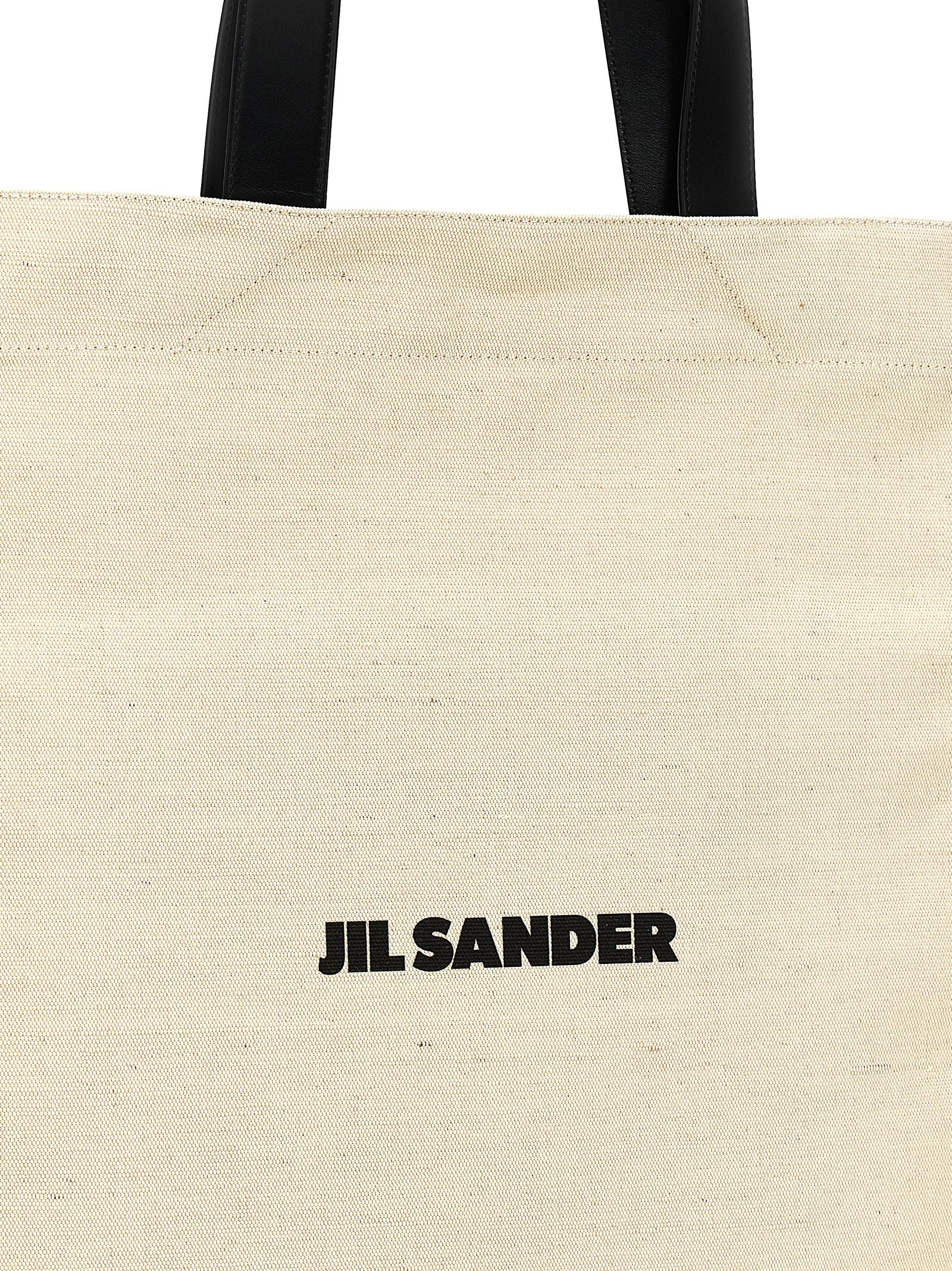 Discover the Jil Sander Bicolor Jute Tote Bag, a masterful blend of jute and cotton, embodying timeless elegance and artisanal luxury for the discerning individual.