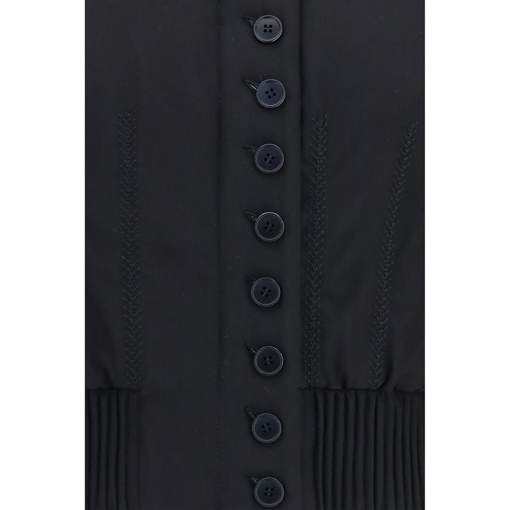 Experience the allure of the Alexander McQueen Black Polyester Bomber, a masterpiece of tailored elegance crafted from luxurious materials, perfect for the discerning individual.