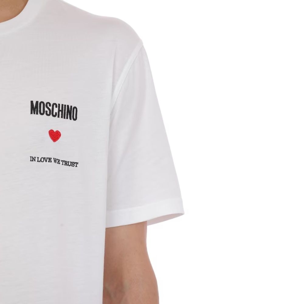 Elevate your wardrobe with the Moschino Couture White Cotton T-Shirt, a luxurious blend of comfort and style, perfect for the discerning fashion connoisseur.