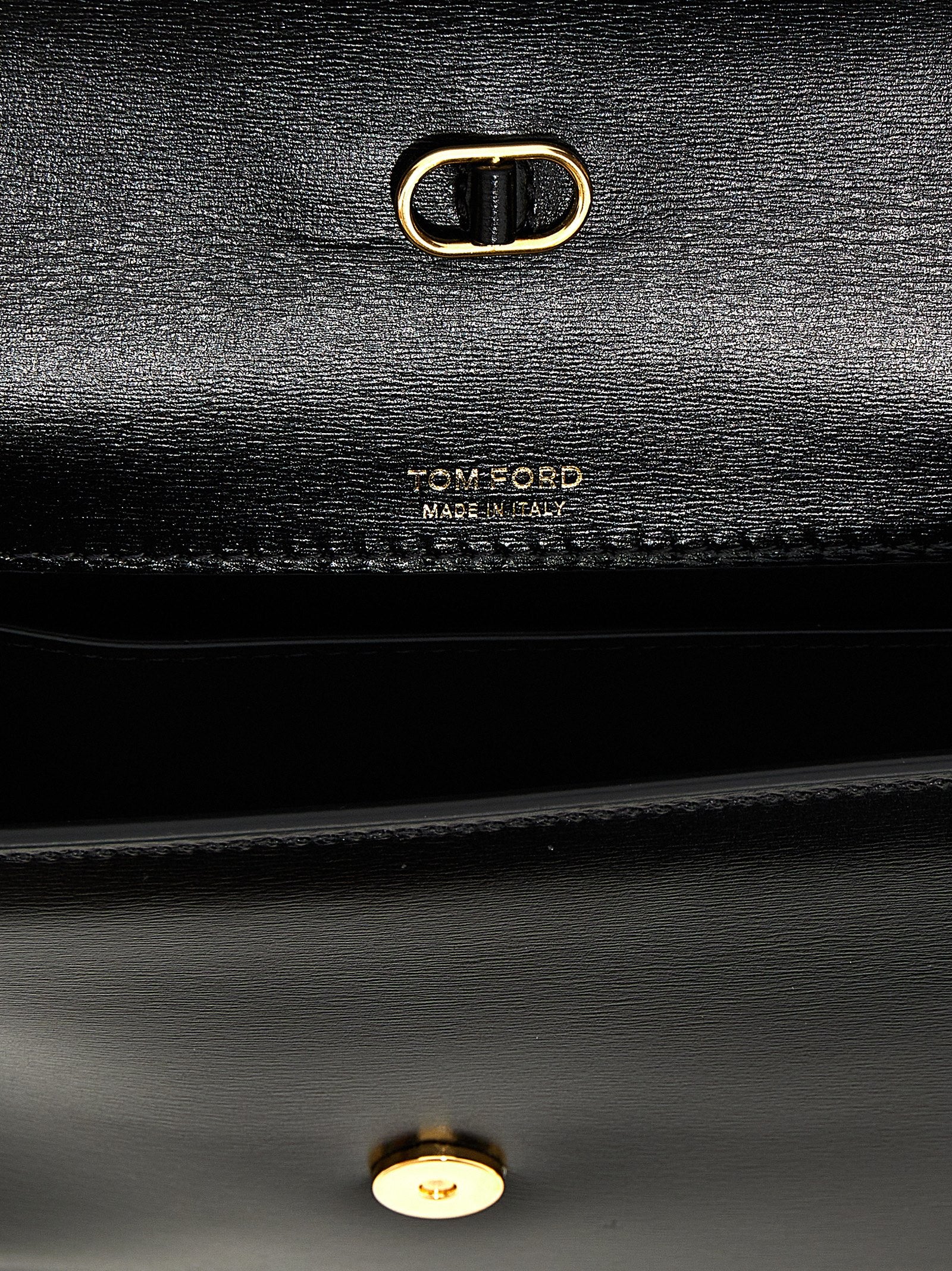 Discover the TOM FORD Black Leather Crossbody Bag, a masterpiece of Italian craftsmanship that embodies timeless elegance and sophistication for the discerning individual.