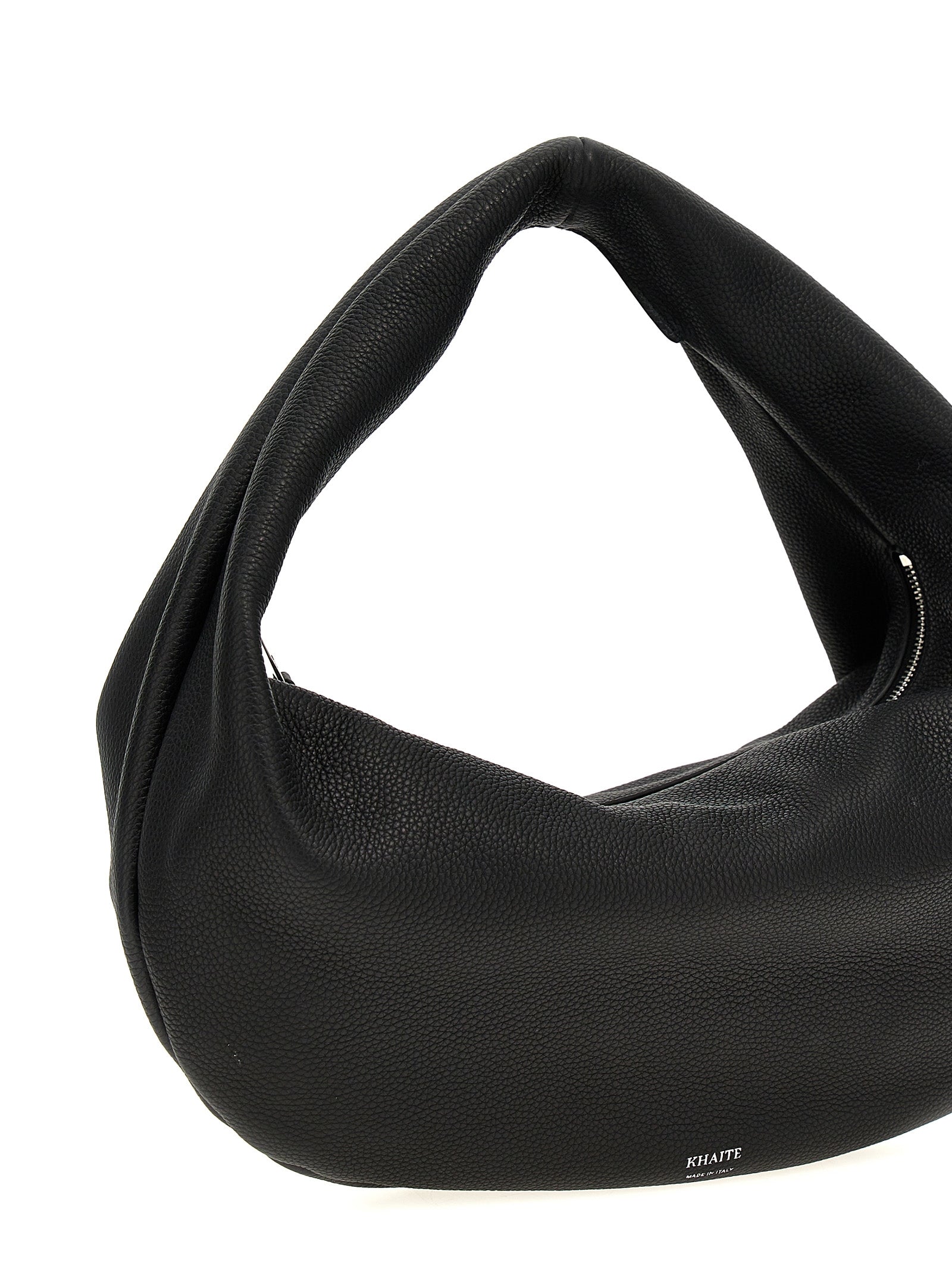 Discover the KHAITE Black Calfskin Shoulder Bag, a timeless blend of artisanal craftsmanship and luxurious design, perfect for the discerning individual.