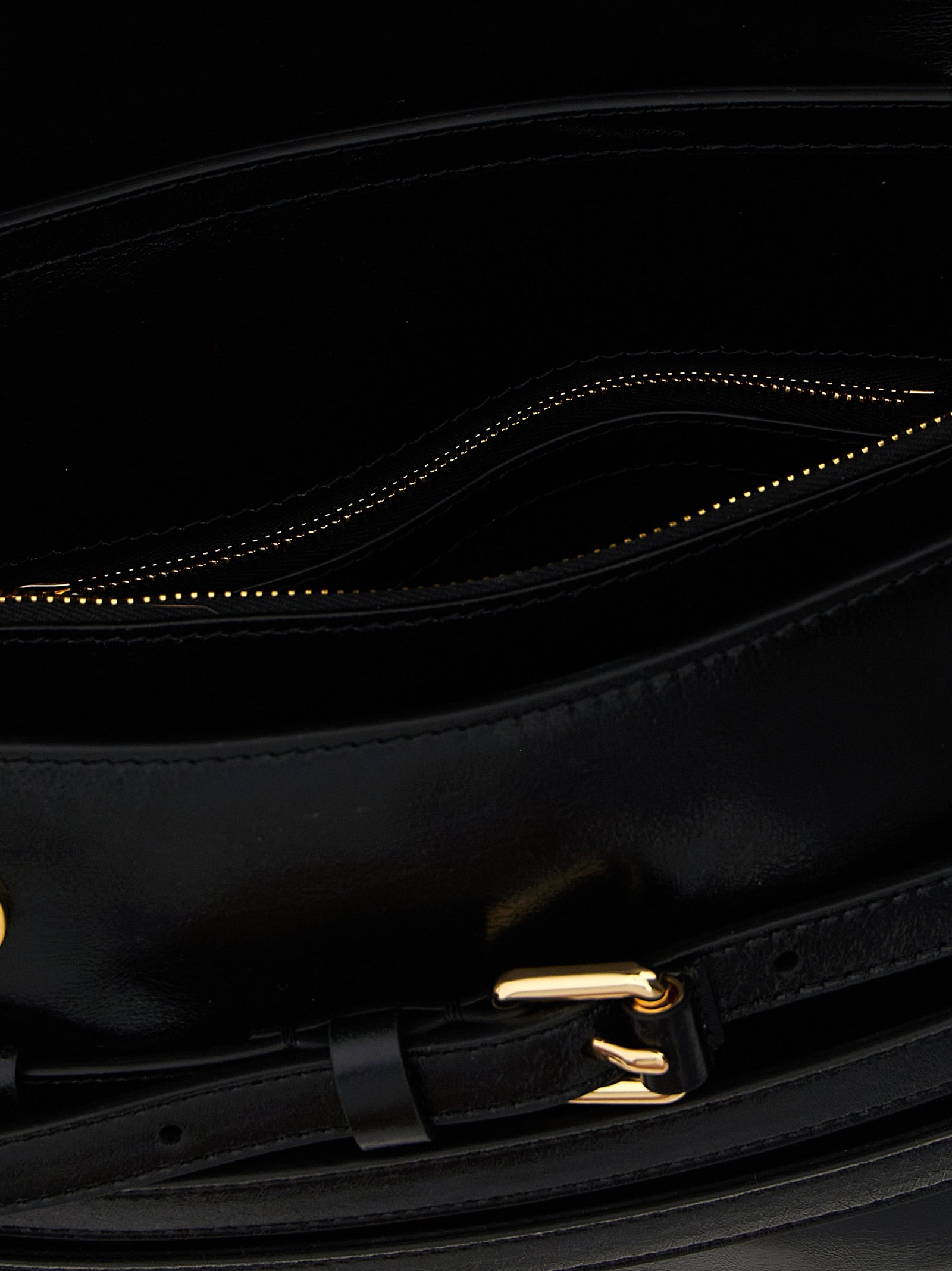 Discover the Moschino Black Leather Crossbody Bag, a masterpiece of Italian craftsmanship, blending elegance and versatility for the discerning fashion connoisseur.