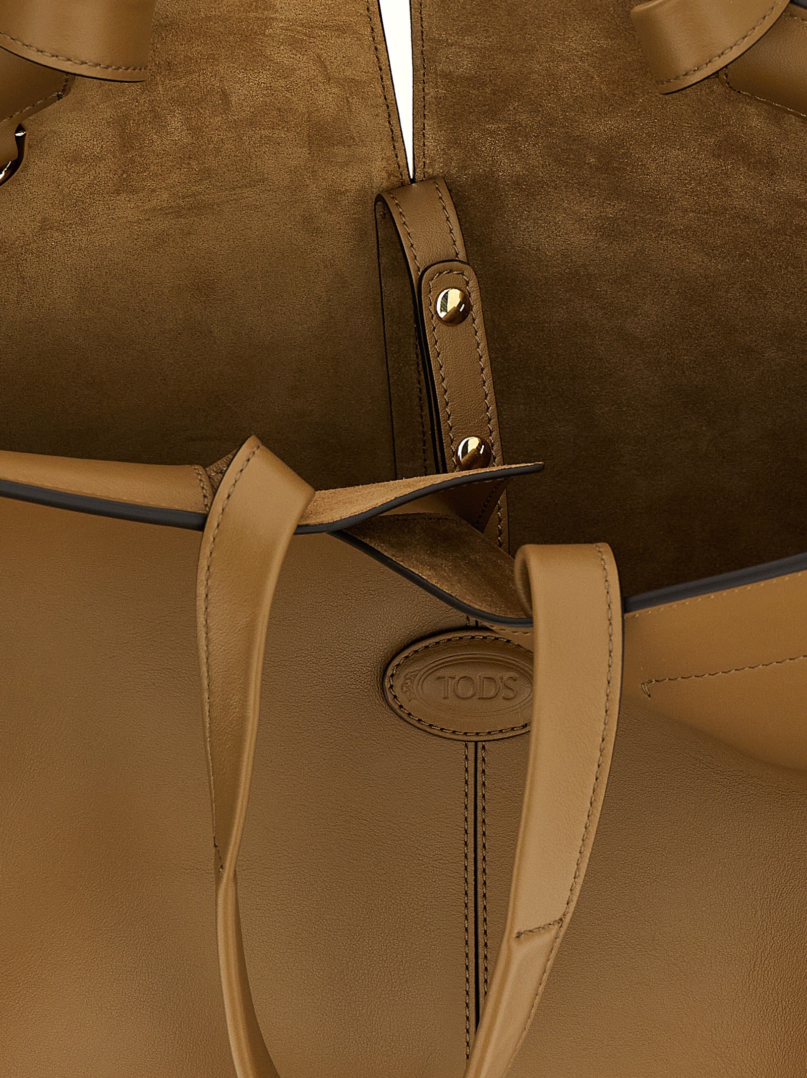 Experience the exquisite Tod's Bicolor Calfskin Tote Bag, a masterpiece of Italian craftsmanship that embodies sophistication and timeless elegance for the discerning individual.