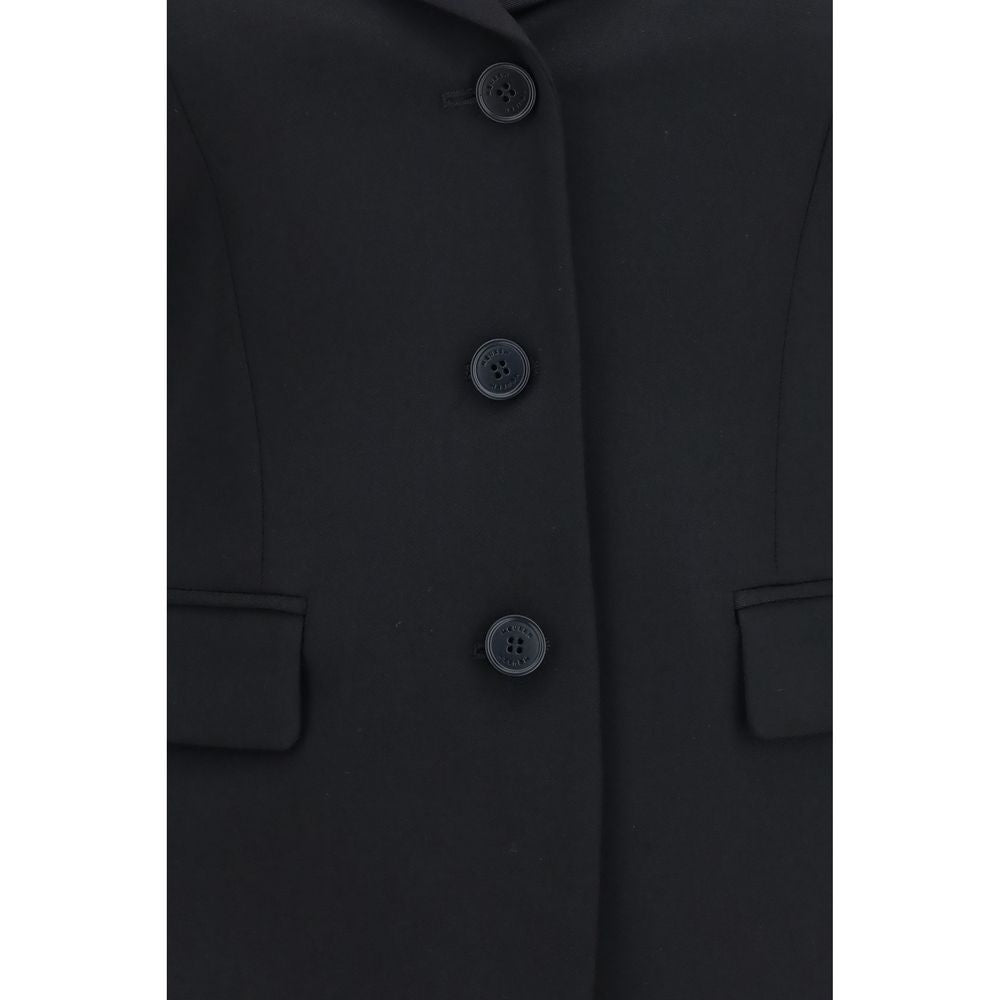 Elevate your wardrobe with the Alexander McQueen Black Wool Oves Aries Full-Length Jacket, a masterpiece of tailored sophistication crafted from luxurious Merino wool.