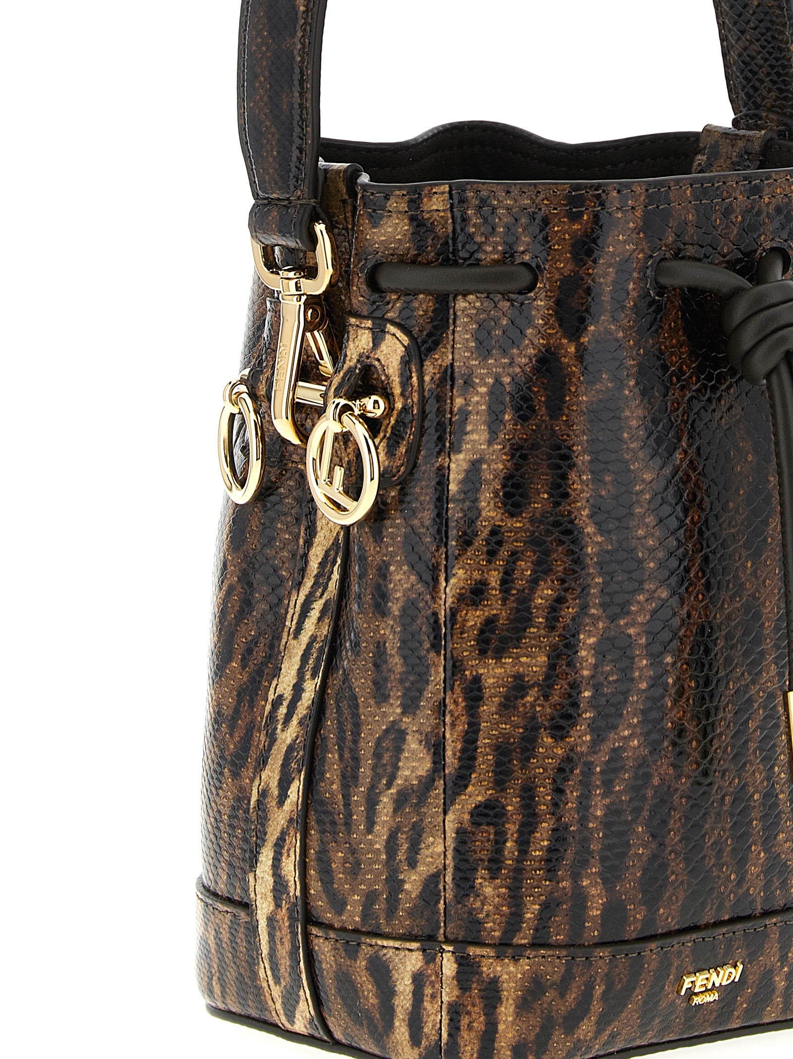 Discover the Fendi Mon Tresor mini bucket bag, an exquisite blend of luxurious karung snake leather and artisanal craftsmanship, perfect for elevating any ensemble.