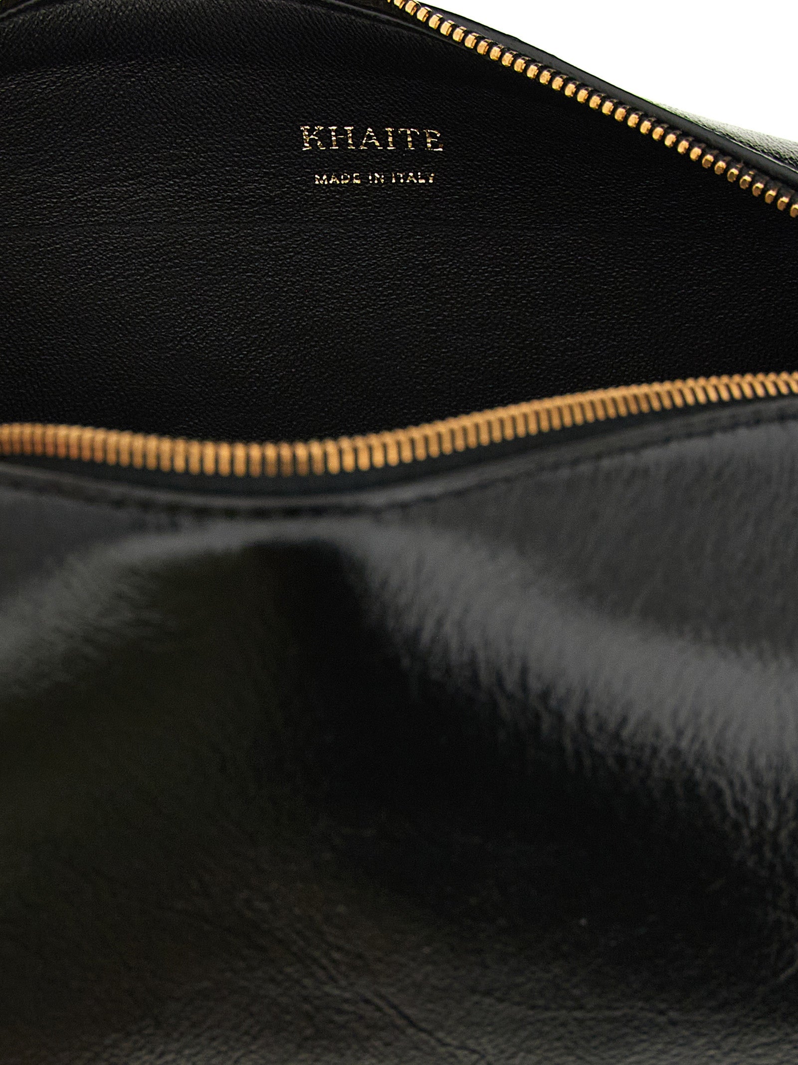 Discover the Khaite Black Calfskin Crossbody Bag, an exquisite blend of artisanal craftsmanship and modern elegance, perfect for the discerning individual.