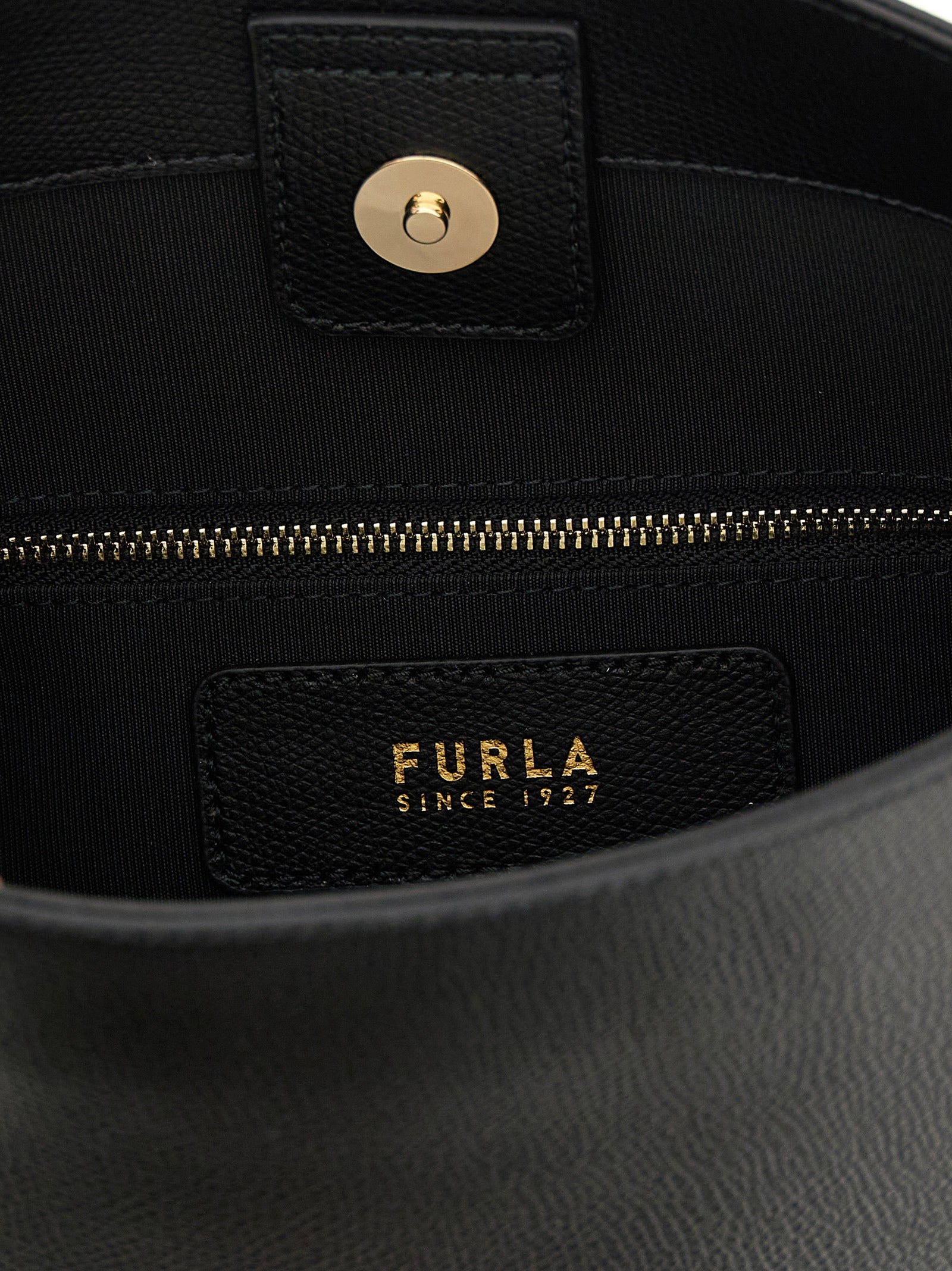 Discover the Furla Black Calfskin Shoulder Bag, a luxurious blend of exquisite craftsmanship and timeless elegance, perfect for the discerning connoisseur.
