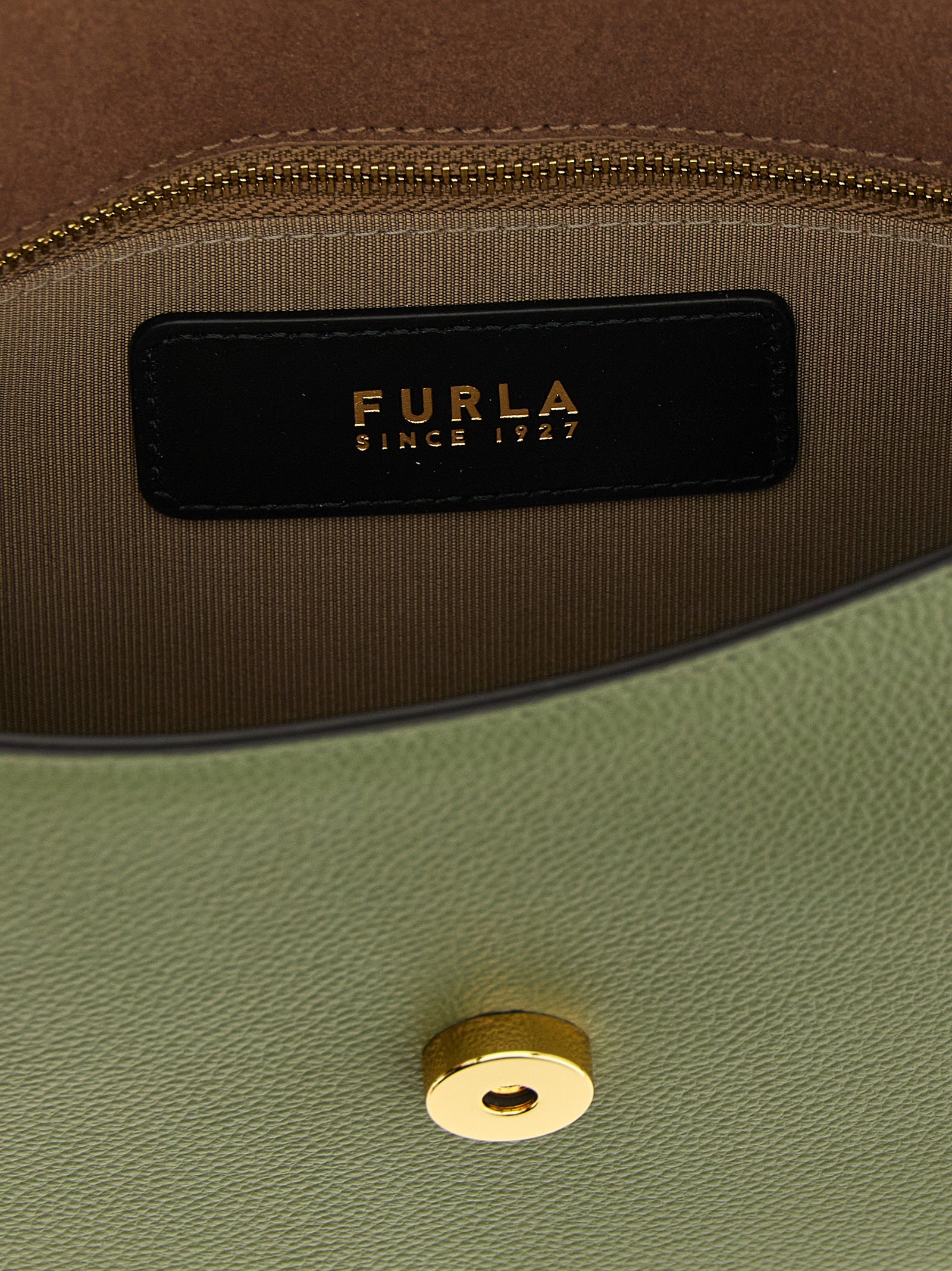 Discover the Furla Bicolor Calfskin Crossbody Bag, a masterpiece of artisanal luxury crafted from premium calfskin, perfect for those who embrace elegance and individuality.