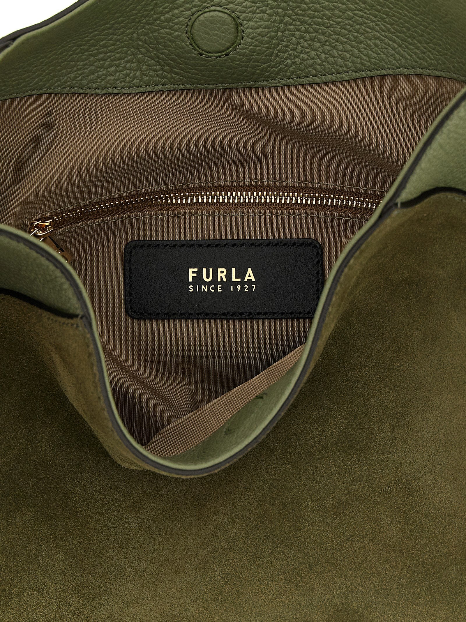 Discover the Furla Bicolor Calfskin Shoulder Bag, a masterful blend of luxurious suede and calfskin, epitomizing elegance and sophistication for the discerning connoisseur.