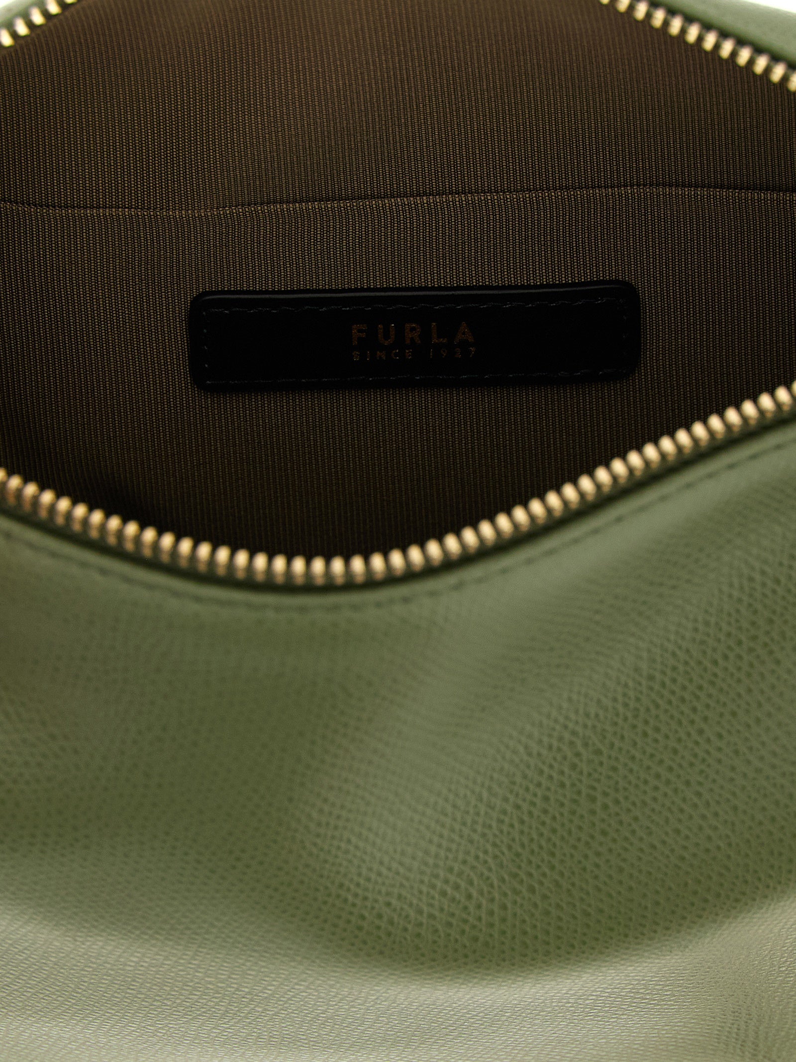 Indulge in the exquisite allure of the Furla Bicolor Calfskin Shoulder Bag, a masterfully crafted accessory that embodies artisanal luxury and timeless elegance.
