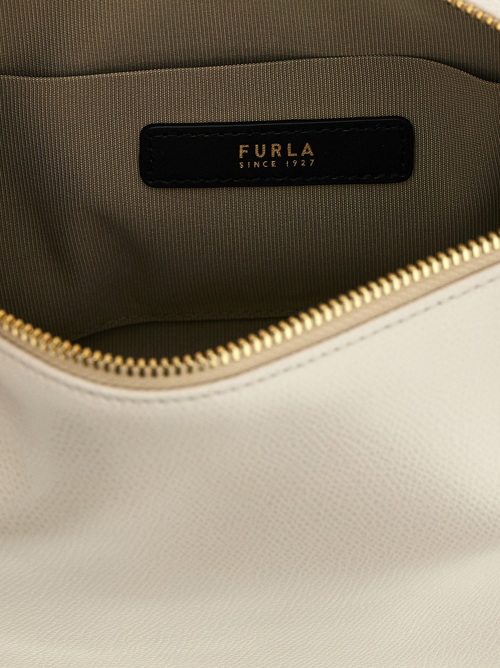 Discover the Furla Beige Calfskin Shoulder Bag, a masterpiece of artisanal luxury crafted from fine grain-effect leather, elevating your style with sophistication and versatility.