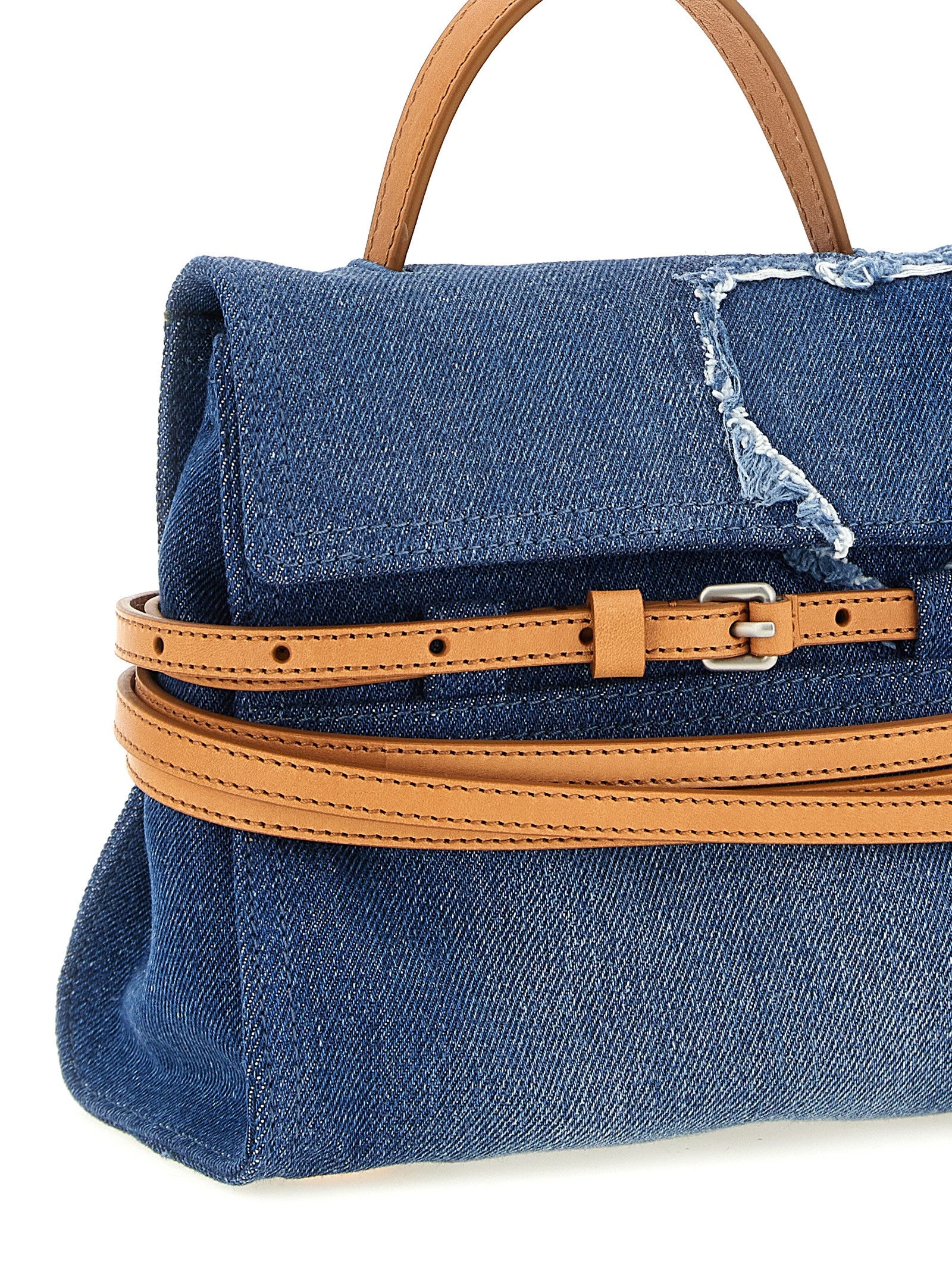 Indulge in the Moschino Blue Cotton Handbag, a luxurious blend of denim and calf leather, handcrafted in Italy. Elevate your style with this bold statement piece.