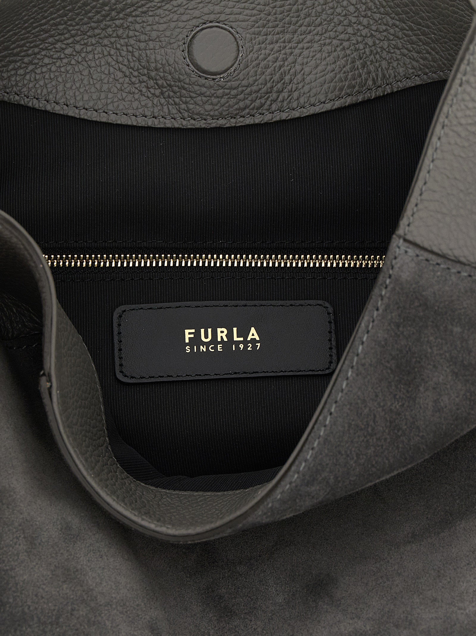 Indulge in the exquisite Furla Gray Calfskin Shoulder Bag, a luxurious blend of suede and calf leather, embodying timeless elegance for the discerning individual.