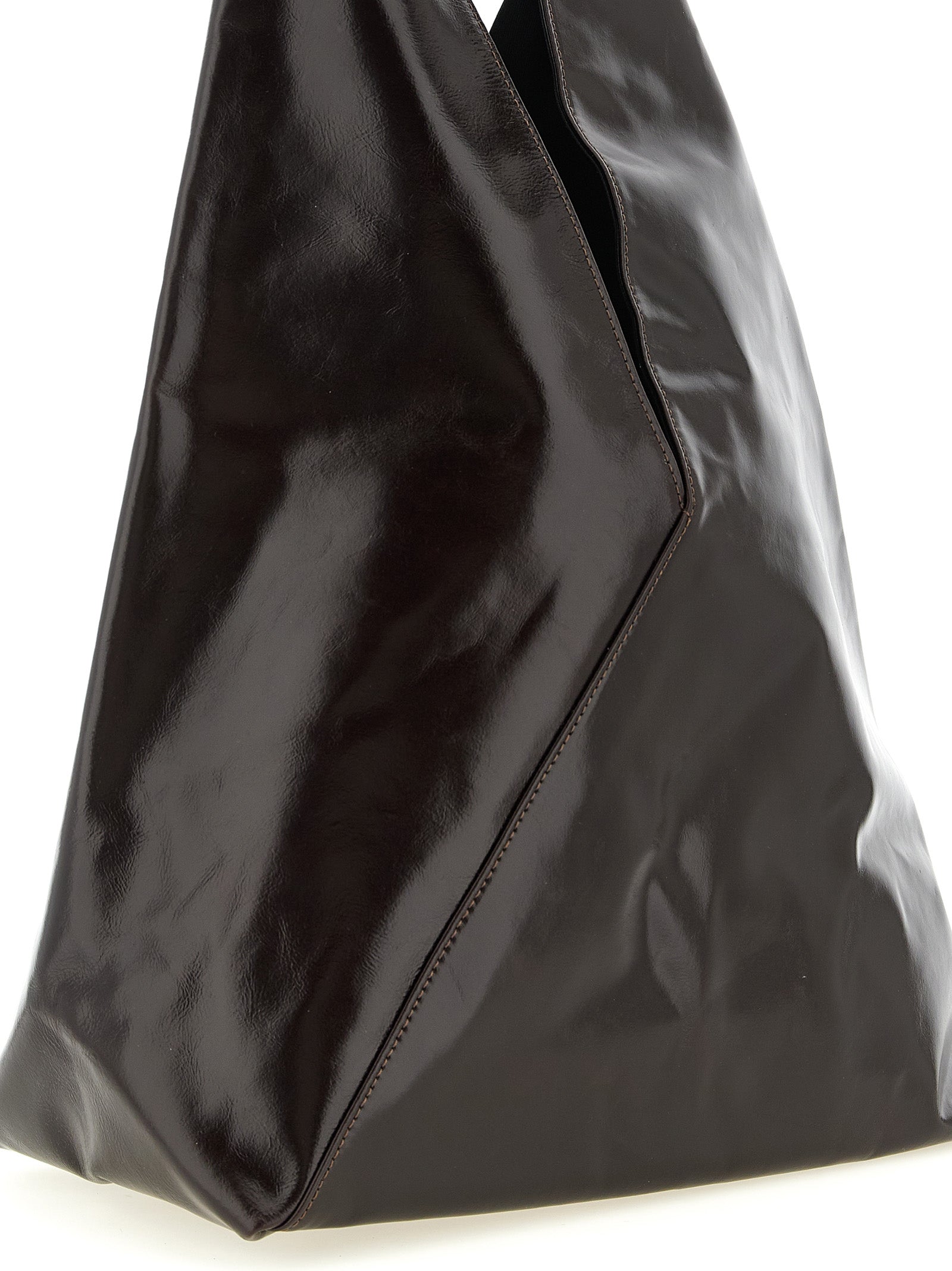 Elevate your elegance with the MM6 Maison Margiela Brown Cowhide Handbag, a masterpiece of artisanal craftsmanship and luxurious design, perfect for discerning tastes.