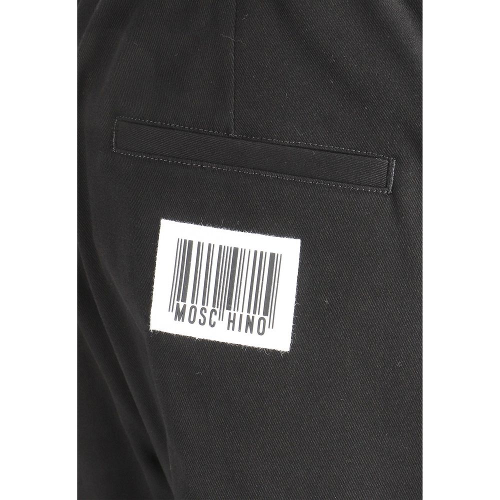 Experience the epitome of luxury with Moschino Black Cotton Joggers, crafted from premium materials for effortless sophistication and timeless style.