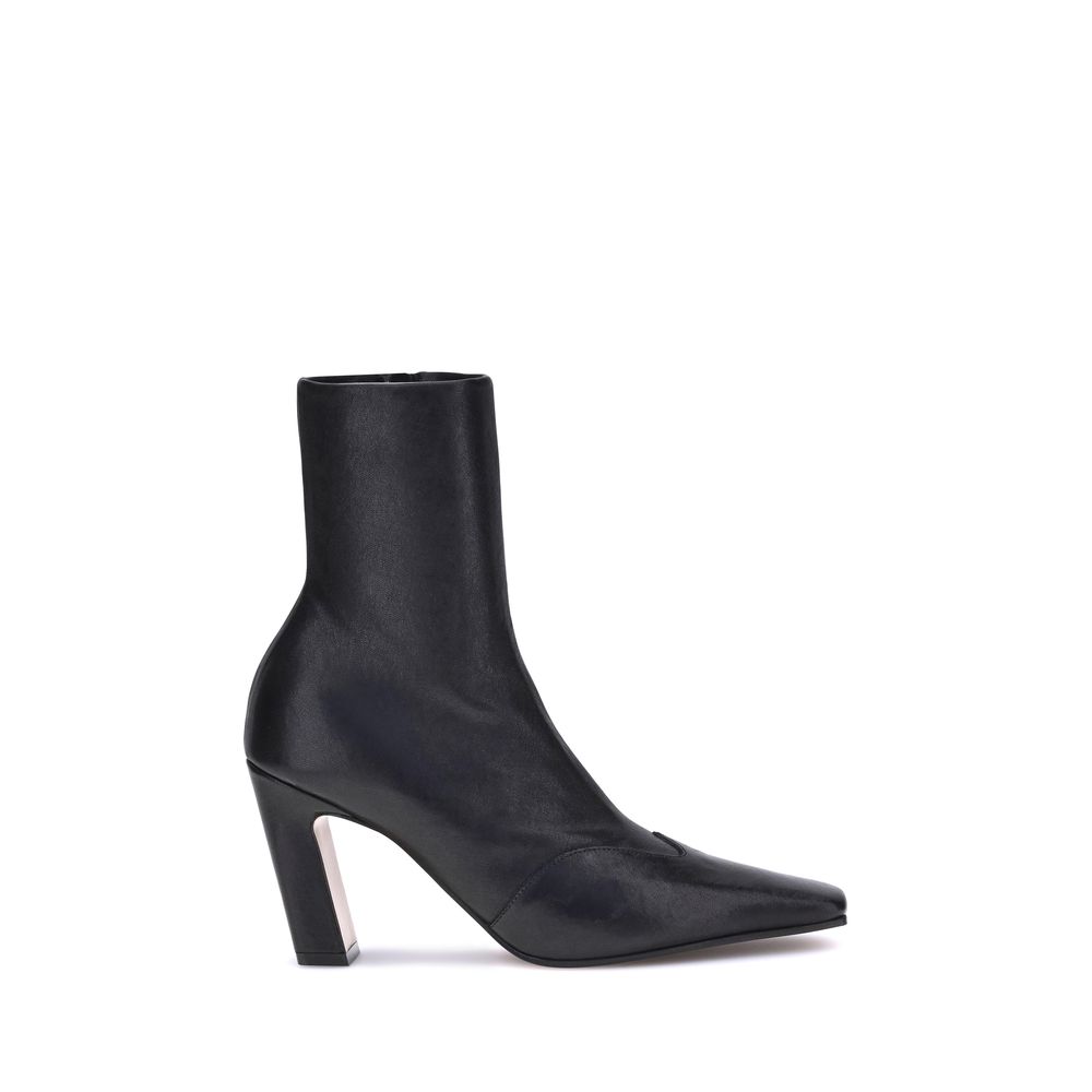 Elevate your style with Khaite's Black Calf Leather Bos Taurus Ankle Boots, a masterpiece of artisanal luxury and bold design for the discerning connoisseur.