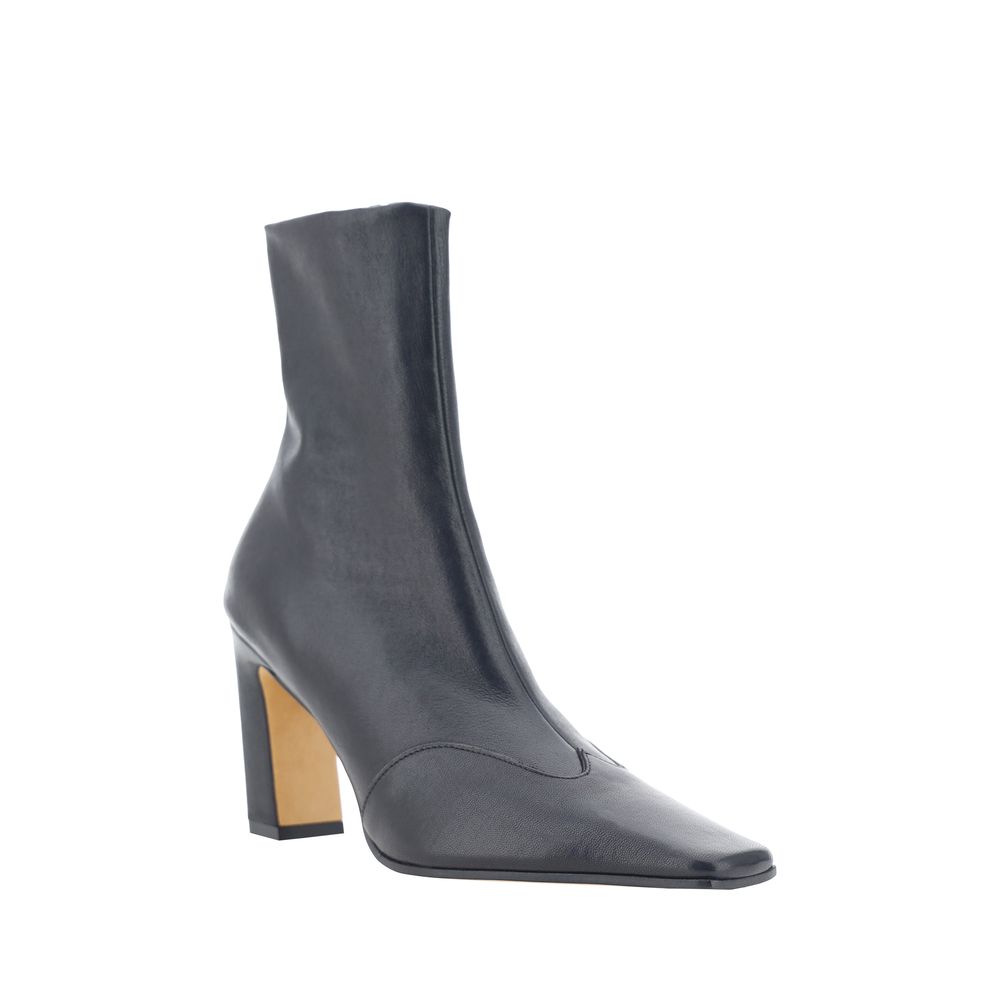 Experience the allure of Khaite's Black Calf Leather Bos Taurus Ankle Boots, where artisanal craftsmanship meets bold design for the discerning connoisseur.