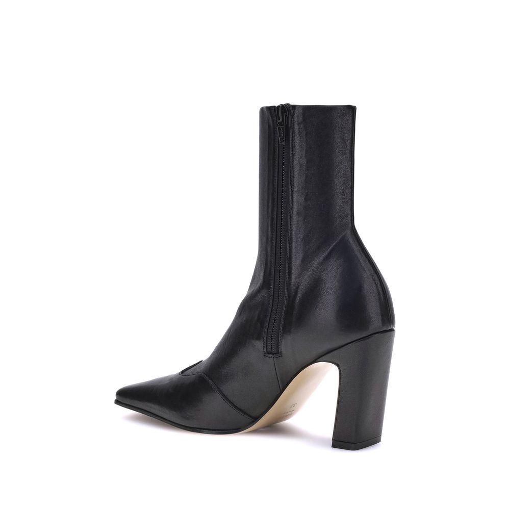 Experience the allure of Khaite's Black Calf Leather Bos Taurus Ankle Boots, where artisanal luxury meets bold design, elevating your style with every step.