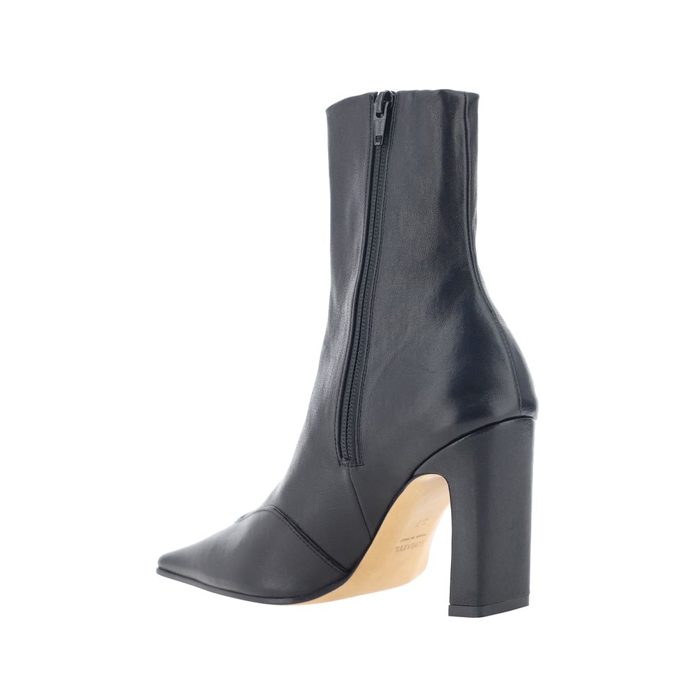 Experience the allure of Khaite's Black Calf Leather Bos Taurus Ankle Boots, where artisanal luxury meets bold design for the discerning connoisseur.
