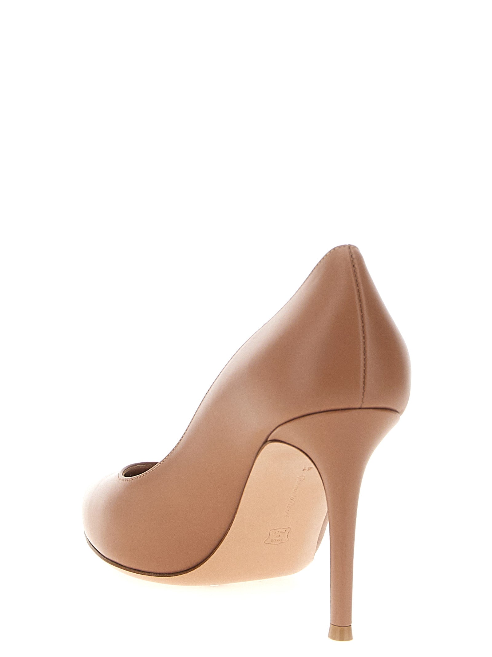 Experience the exquisite allure of Gianvito Rossi's Beige Calfskin High Heel Pumps, where Italian craftsmanship meets timeless elegance for the discerning individual.