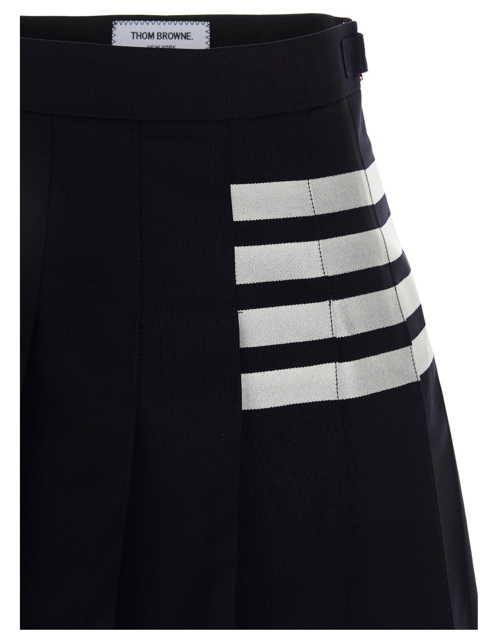 Experience the exquisite artistry of the Thom Browne Blue Wool Long Skirt, a luxurious blend of 100% wool and chic design, perfect for elevating any sophisticated wardrobe.